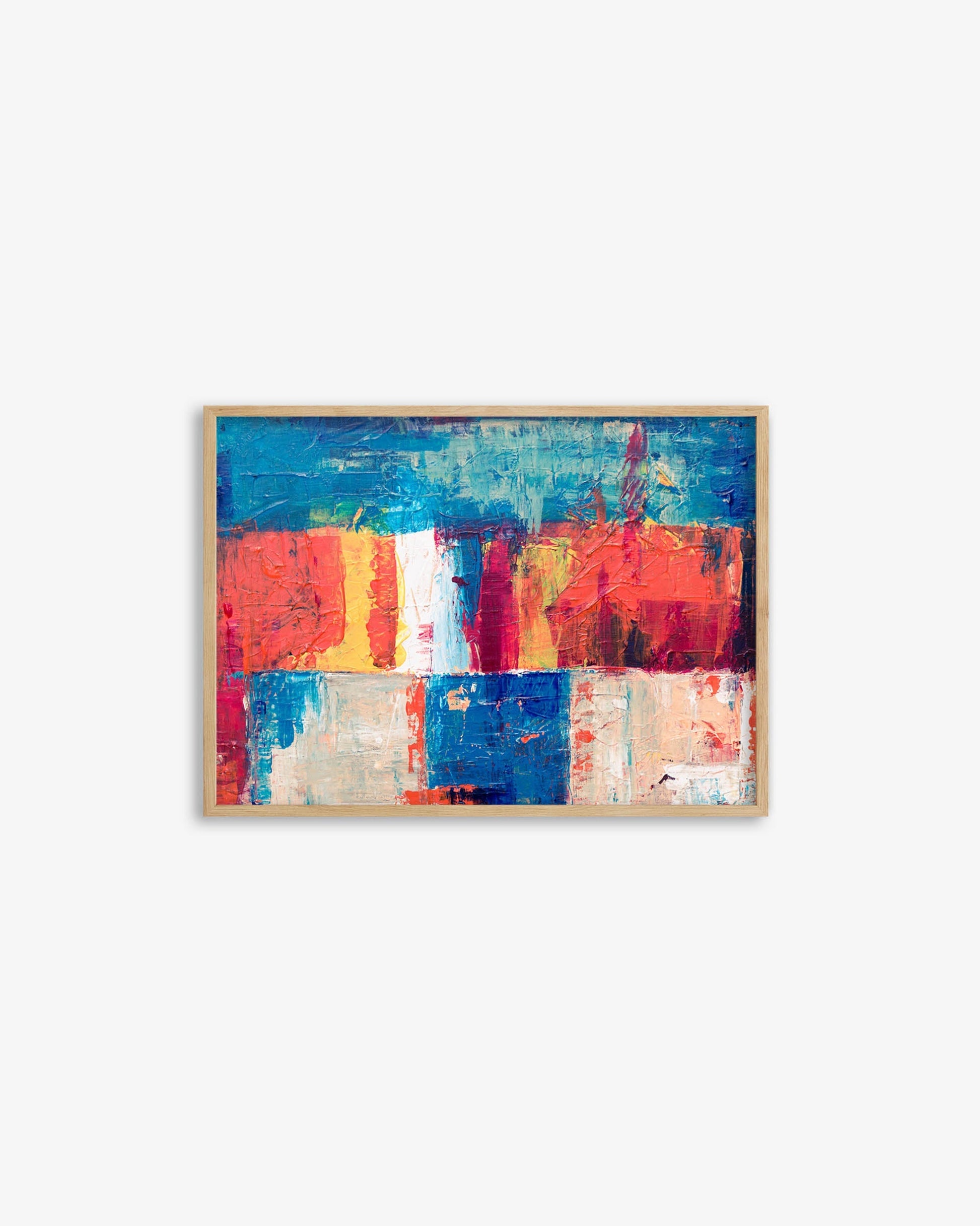 Framed abstract artwork with colorful blocks on a white background