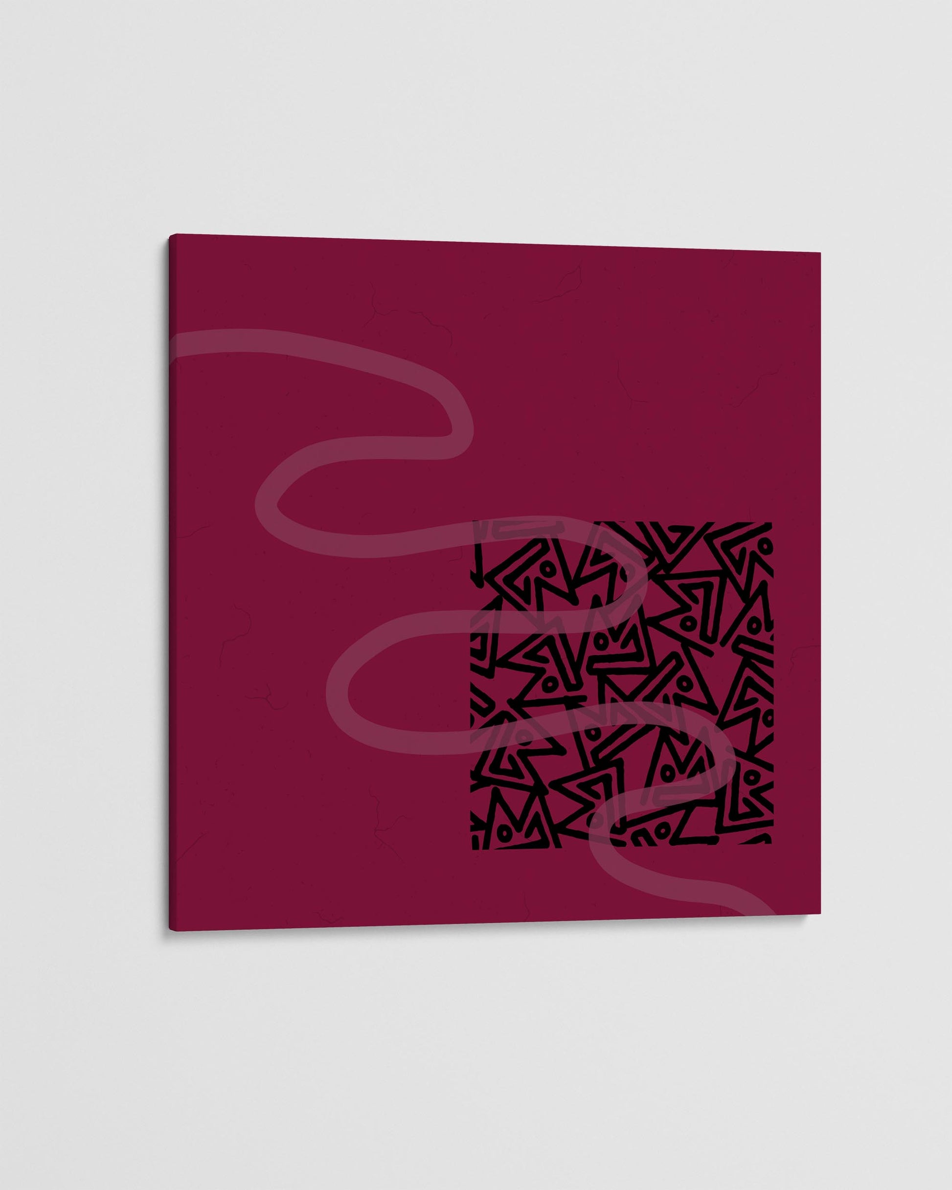 Red book with black abstract design on a white background