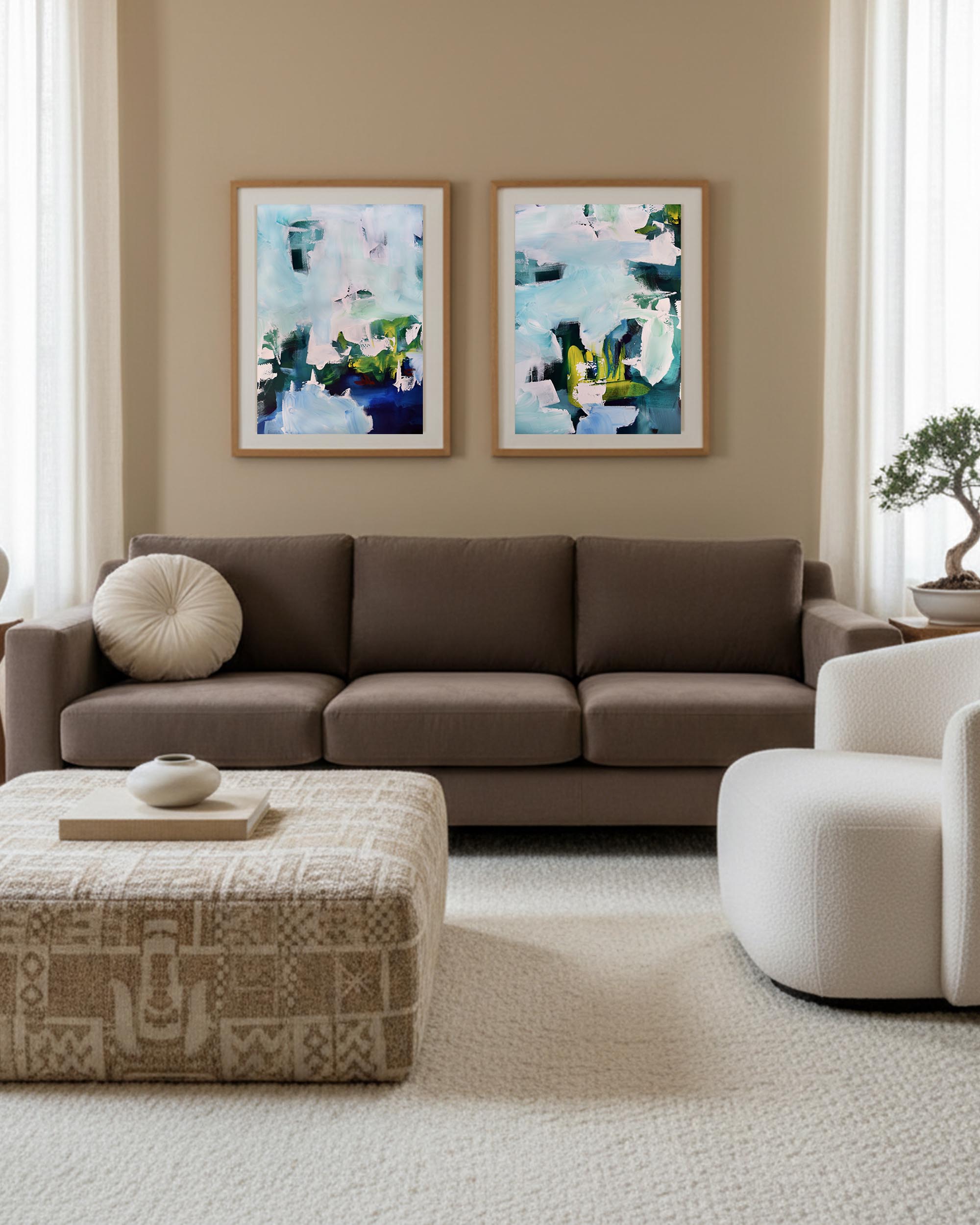 Living room with a brown sectional sofa, patterned ottoman, and abstract wall art.