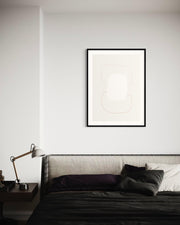 Framed abstract art above a bed in a bedroom setting