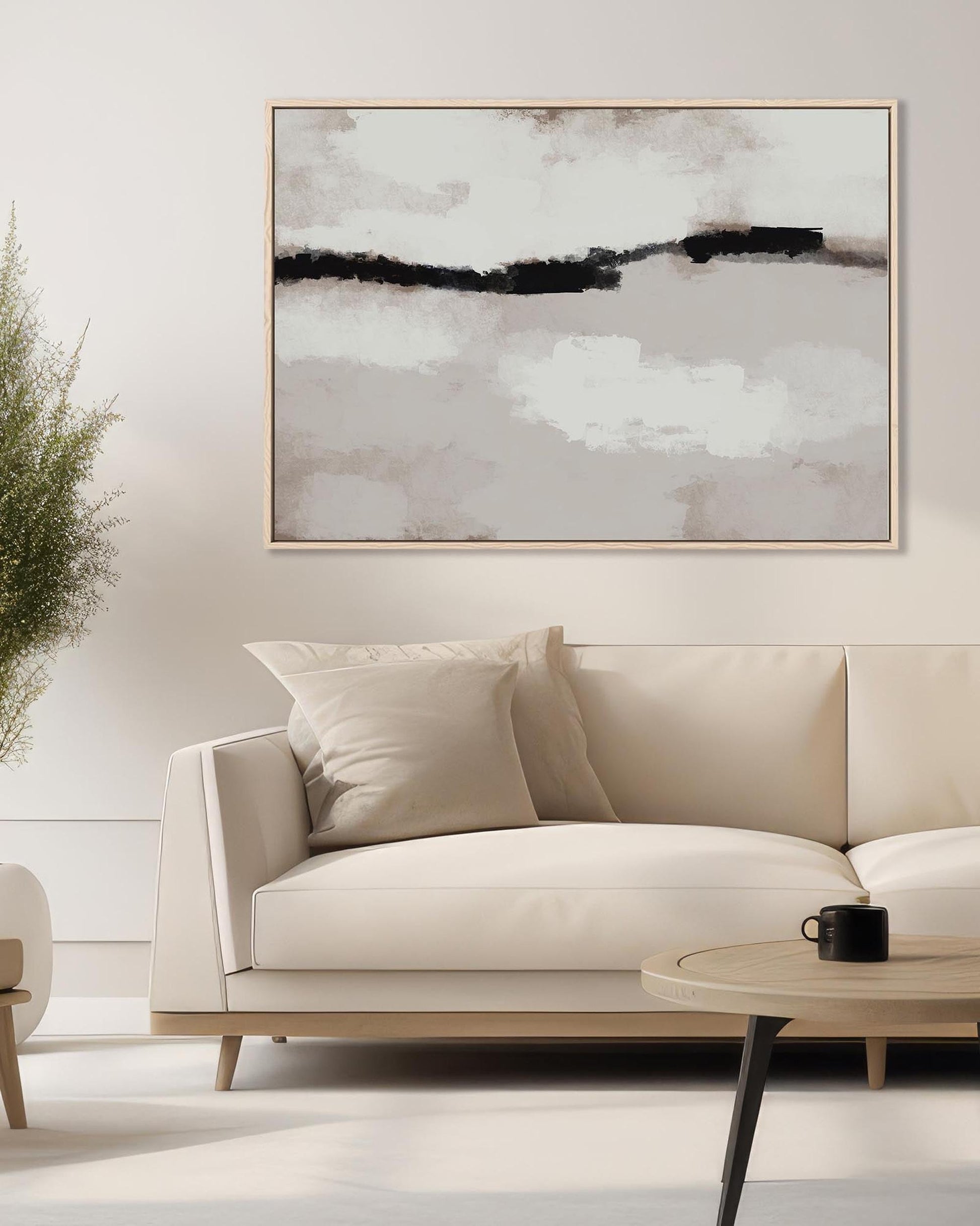 Modern living room with a white sofa, abstract painting, and coffee table.