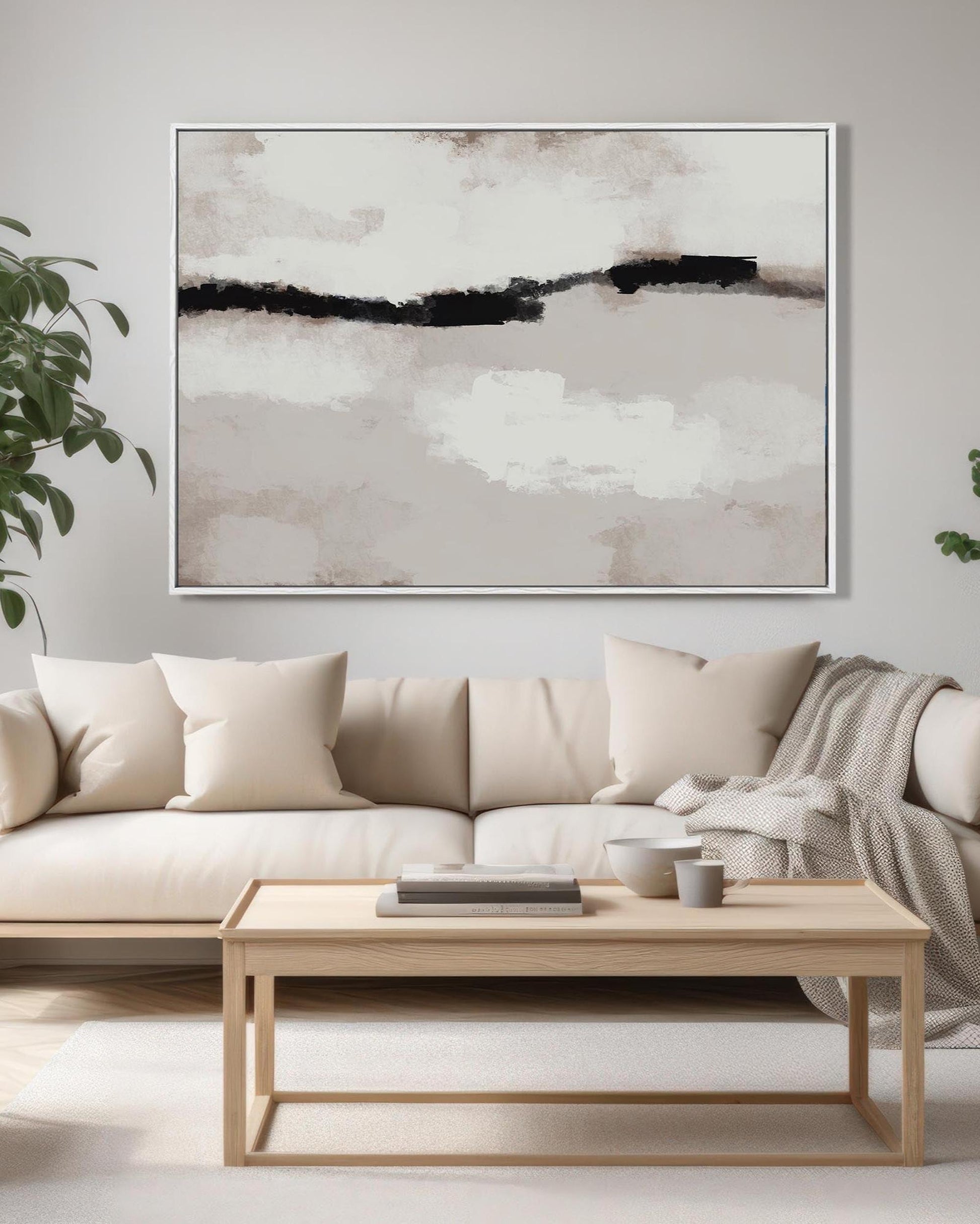 Modern living room with a beige sofa, wooden coffee table, and abstract art on the wall.