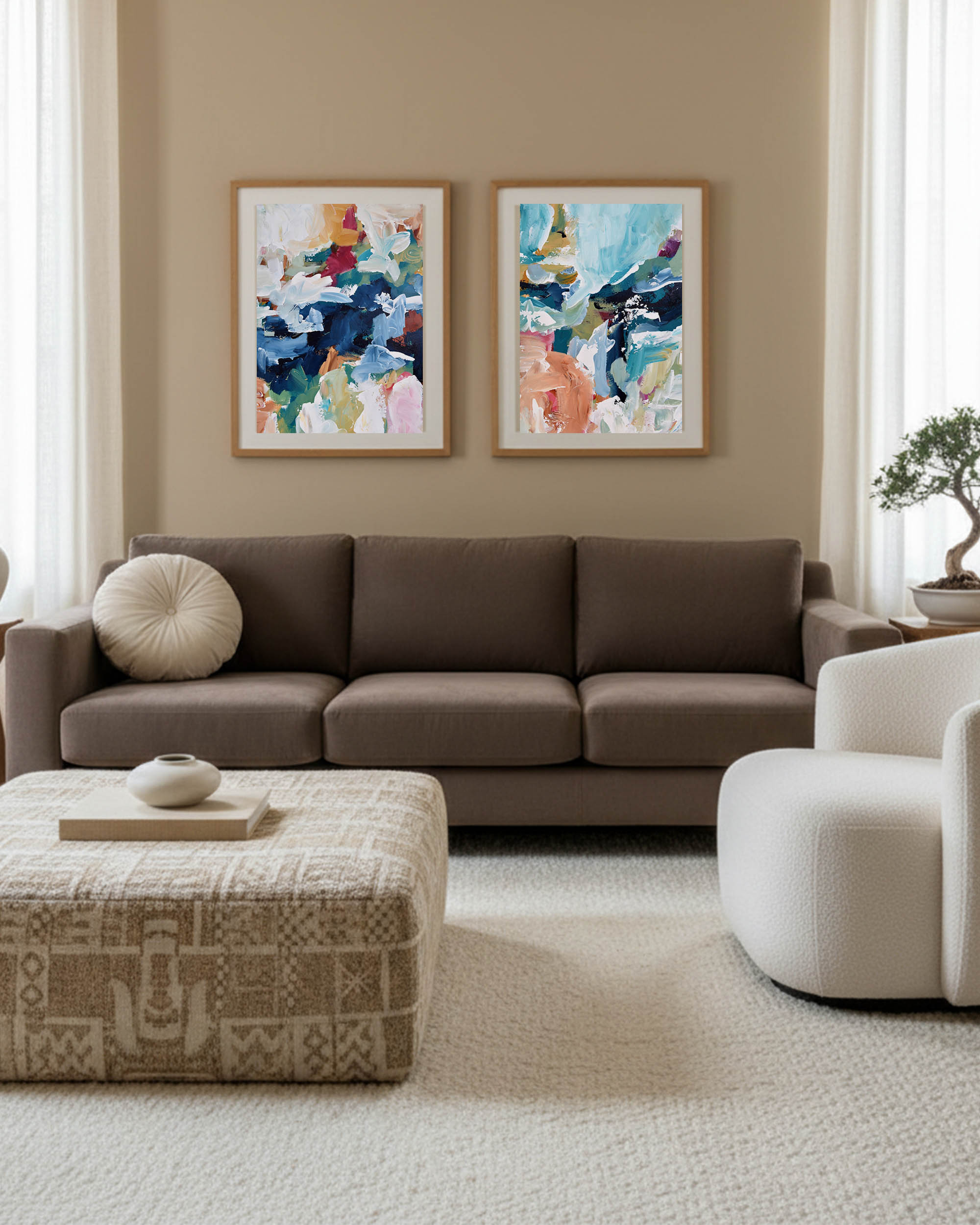 two piece wall art in pared down colours in beige living room with brown 3 seater sofa and occasion chair.