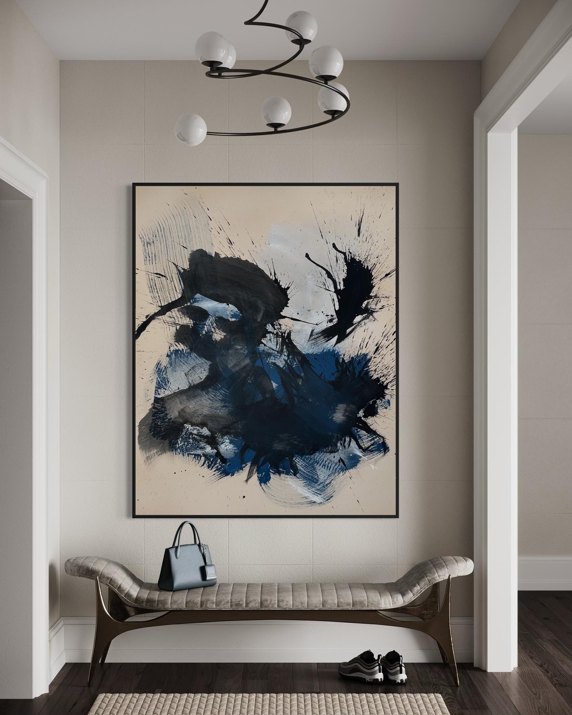 Abstract art piece on a wall in a modern interior setting with a bench and handbag.