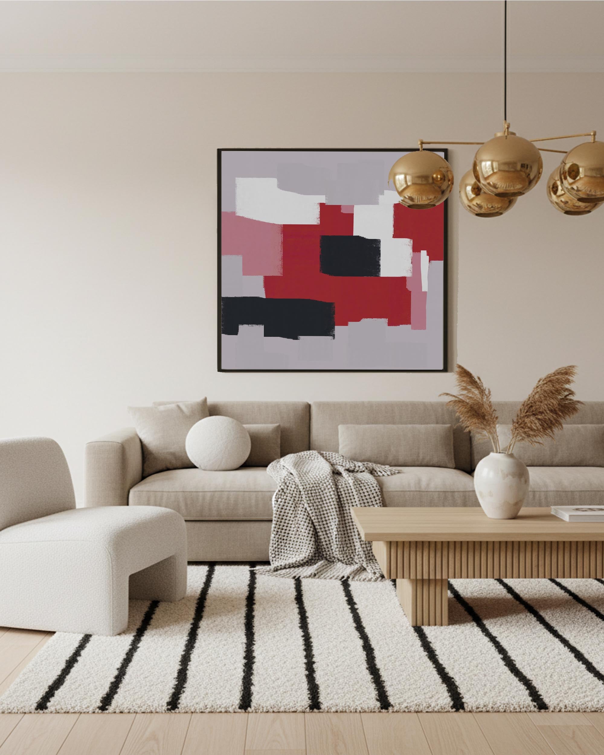 Modern living room with a beige sofa, abstract art, and decorative elements.