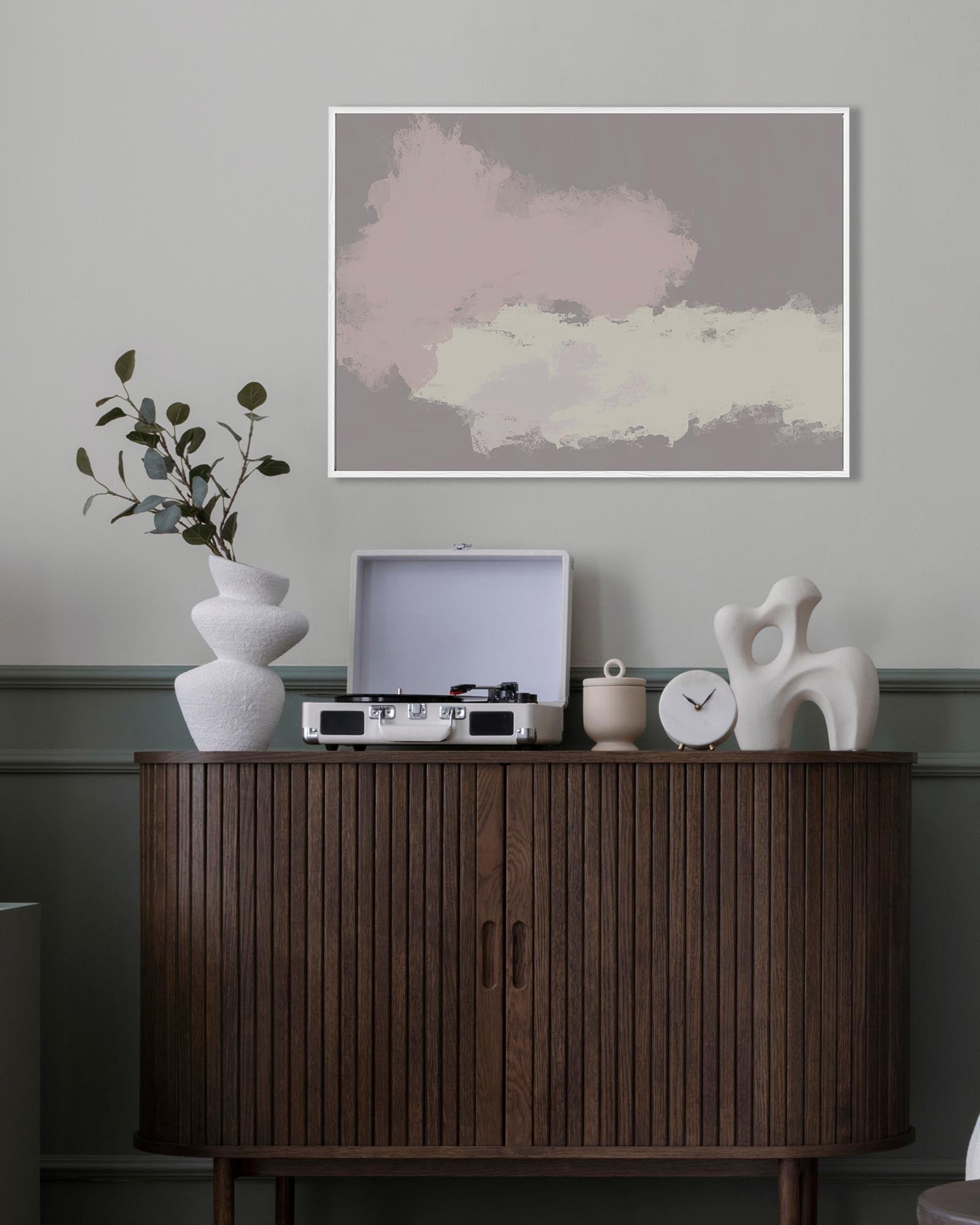 Wooden cabinet with decorative items against a gray wall with abstract art
