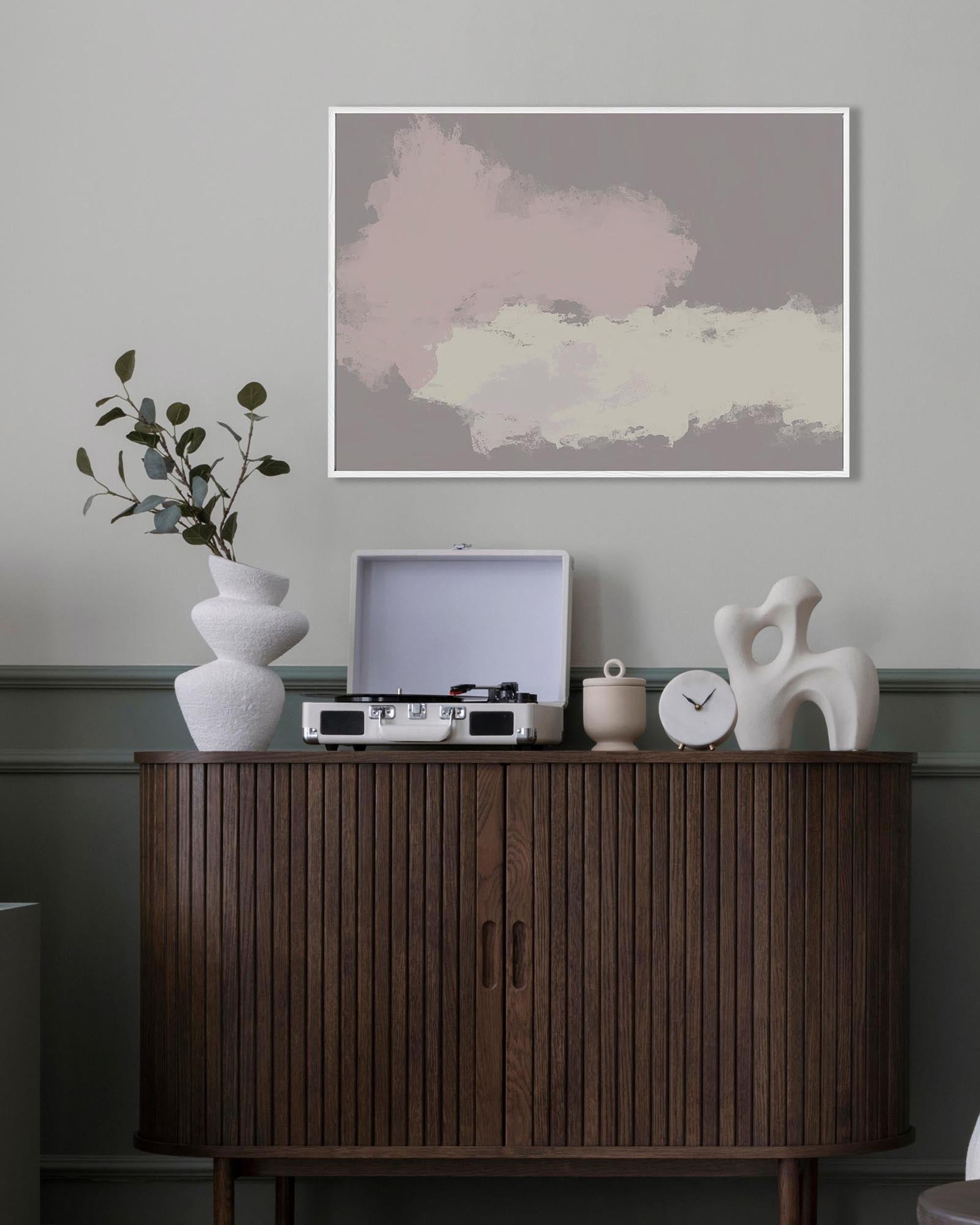 Wooden cabinet with decorative items against a gray wall with abstract art