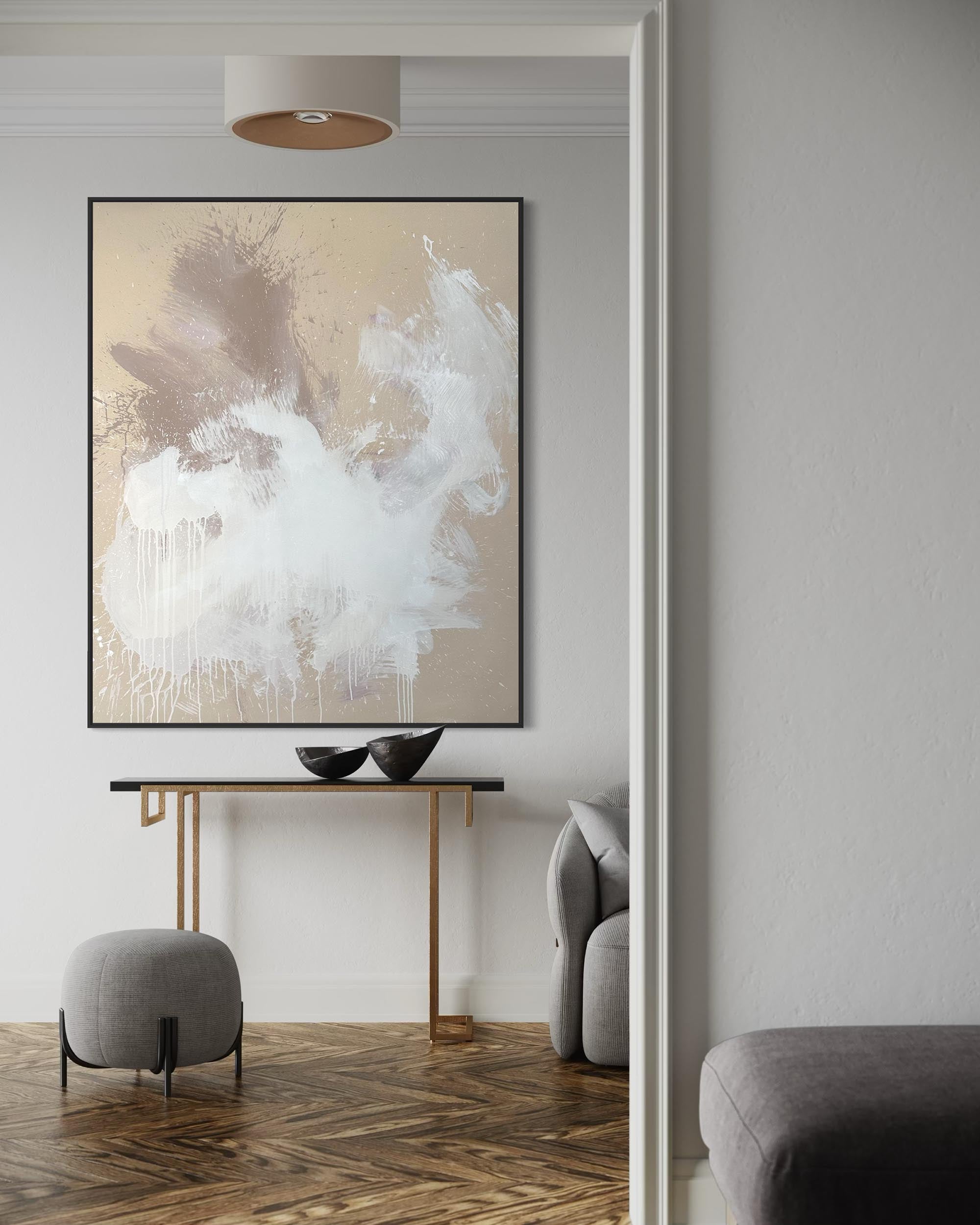 Modern interior with abstract art on a wall, console table, and gray chairs.