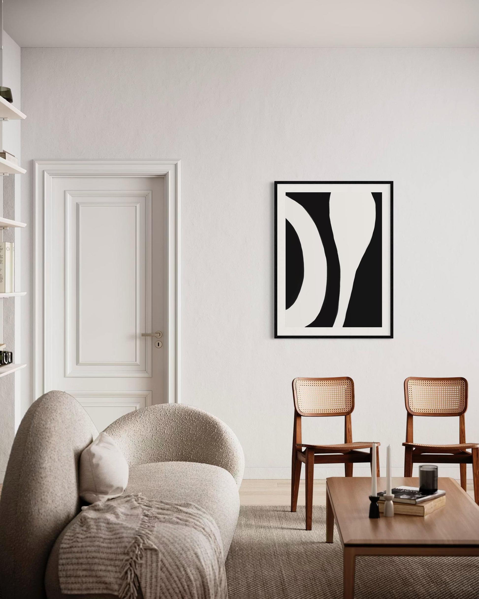 Modern living room with a sofa, coffee table, and abstract art on the wall.