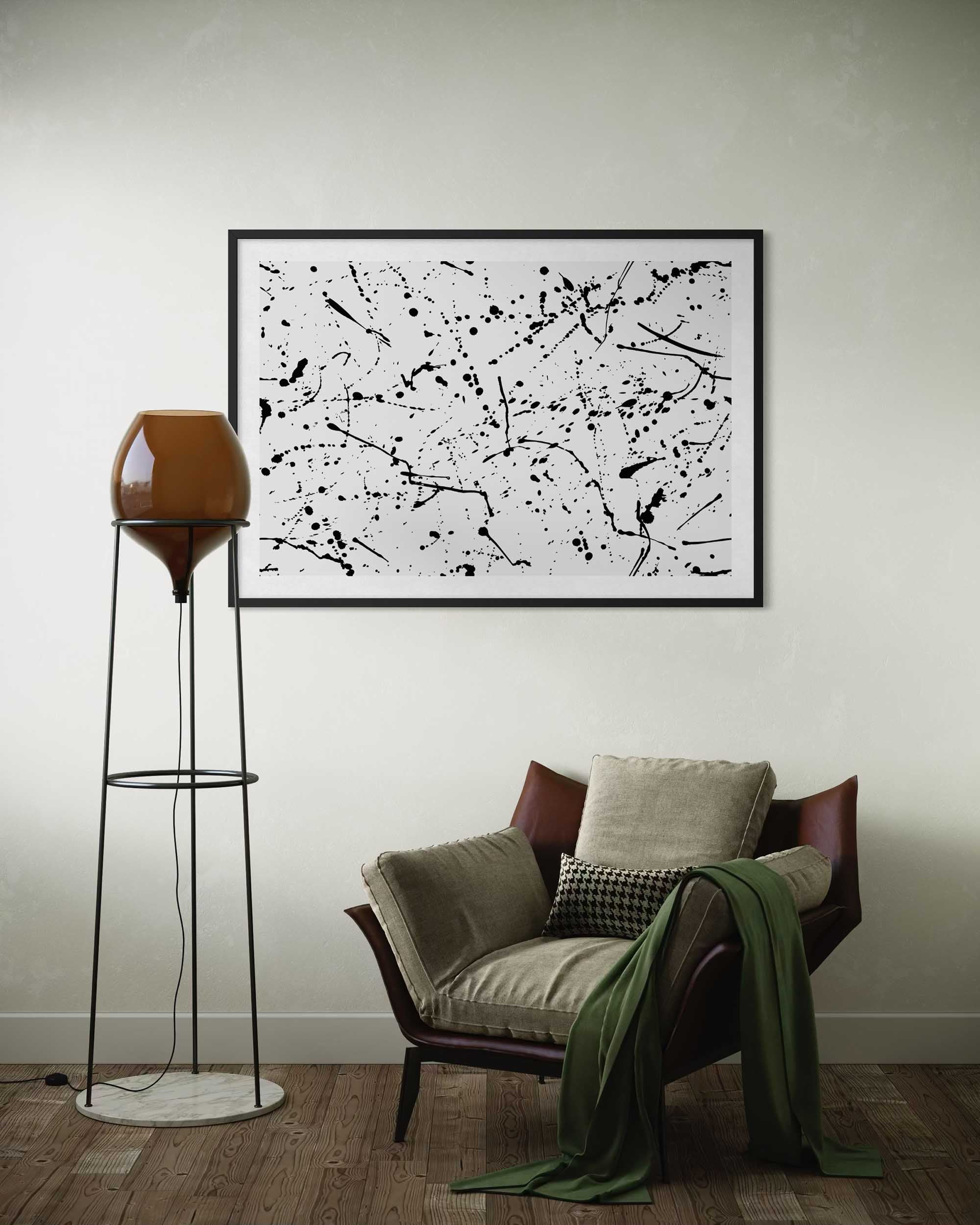 Modern interior with abstract art, chair, and floor lamp.
