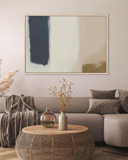 Modern living room with a gray sofa, abstract art, and decorative items.