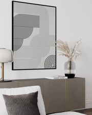 Modern interior with abstract wall art, sideboard, and decorative elements.