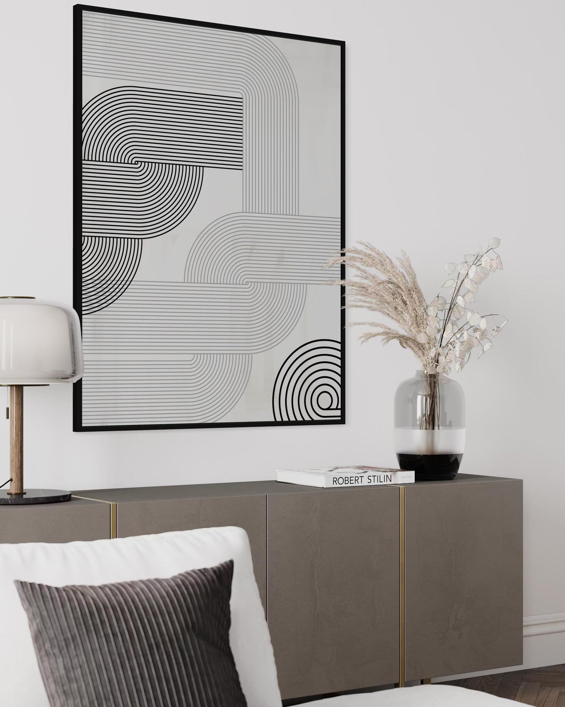 Modern interior with abstract wall art, sideboard, and decorative elements.
