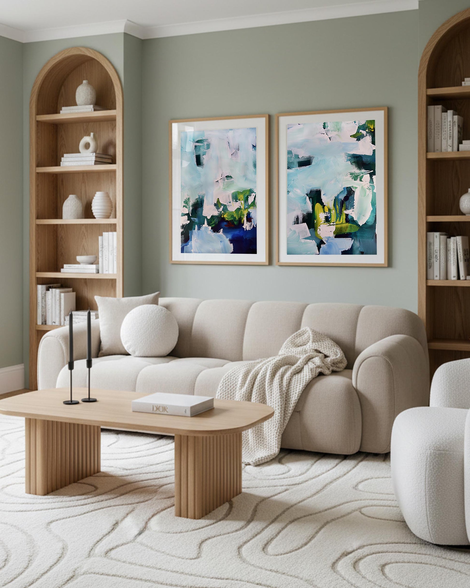 Modern living room with beige sofa, wooden coffee table, and abstract art on the wall.
