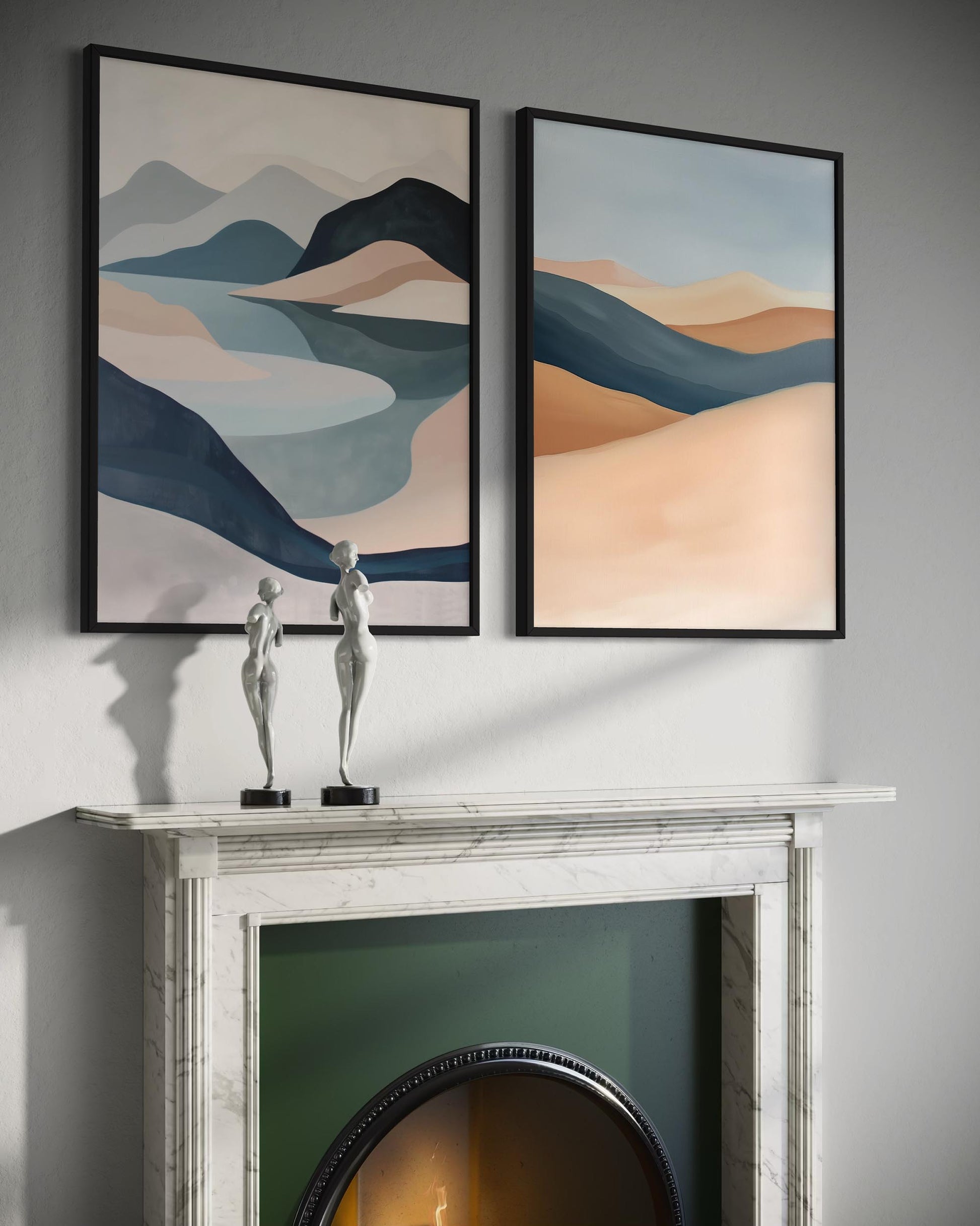 Two abstract landscape paintings above a fireplace with decorative statues.