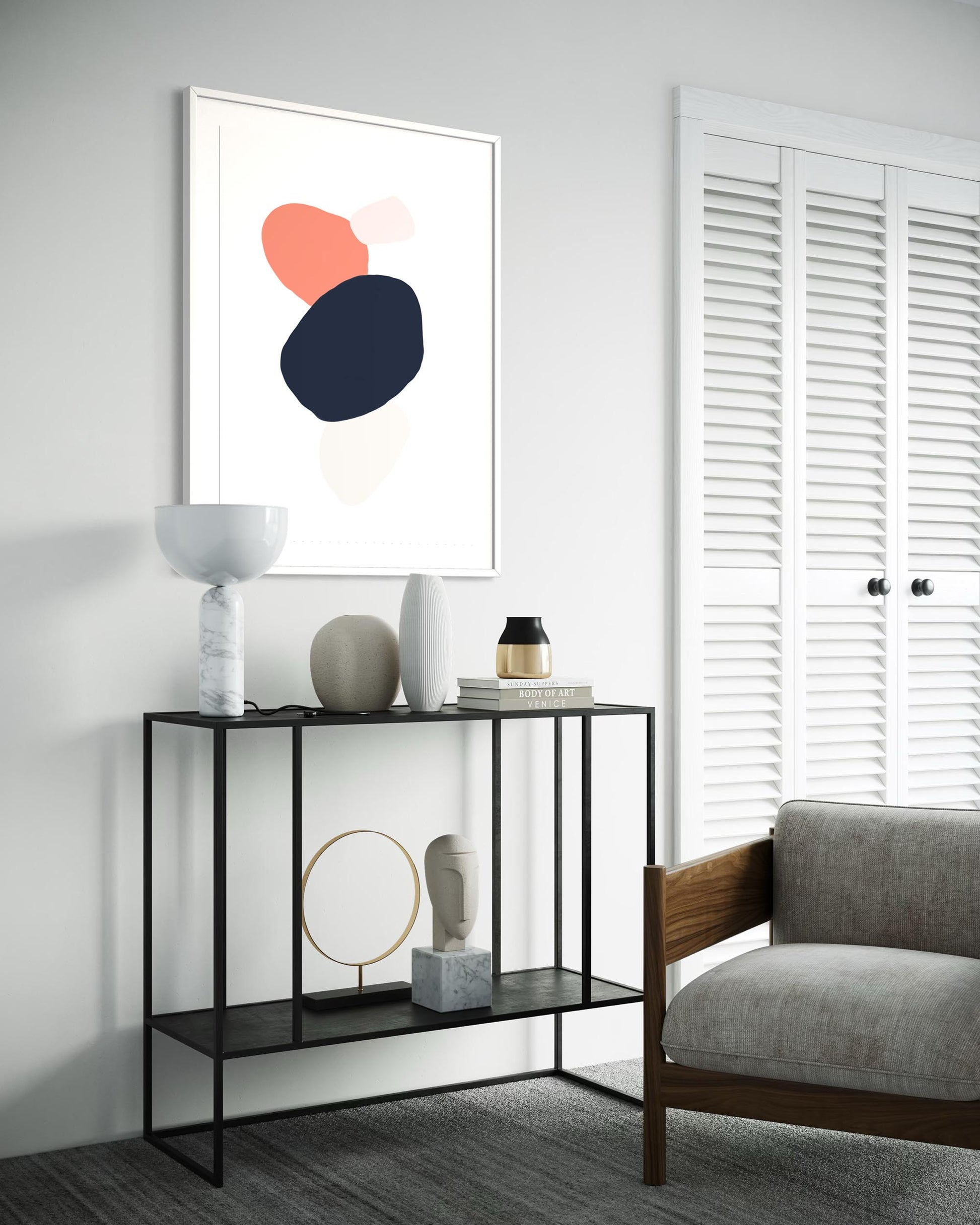 Modern living room with a console table, abstract art, and a chair.