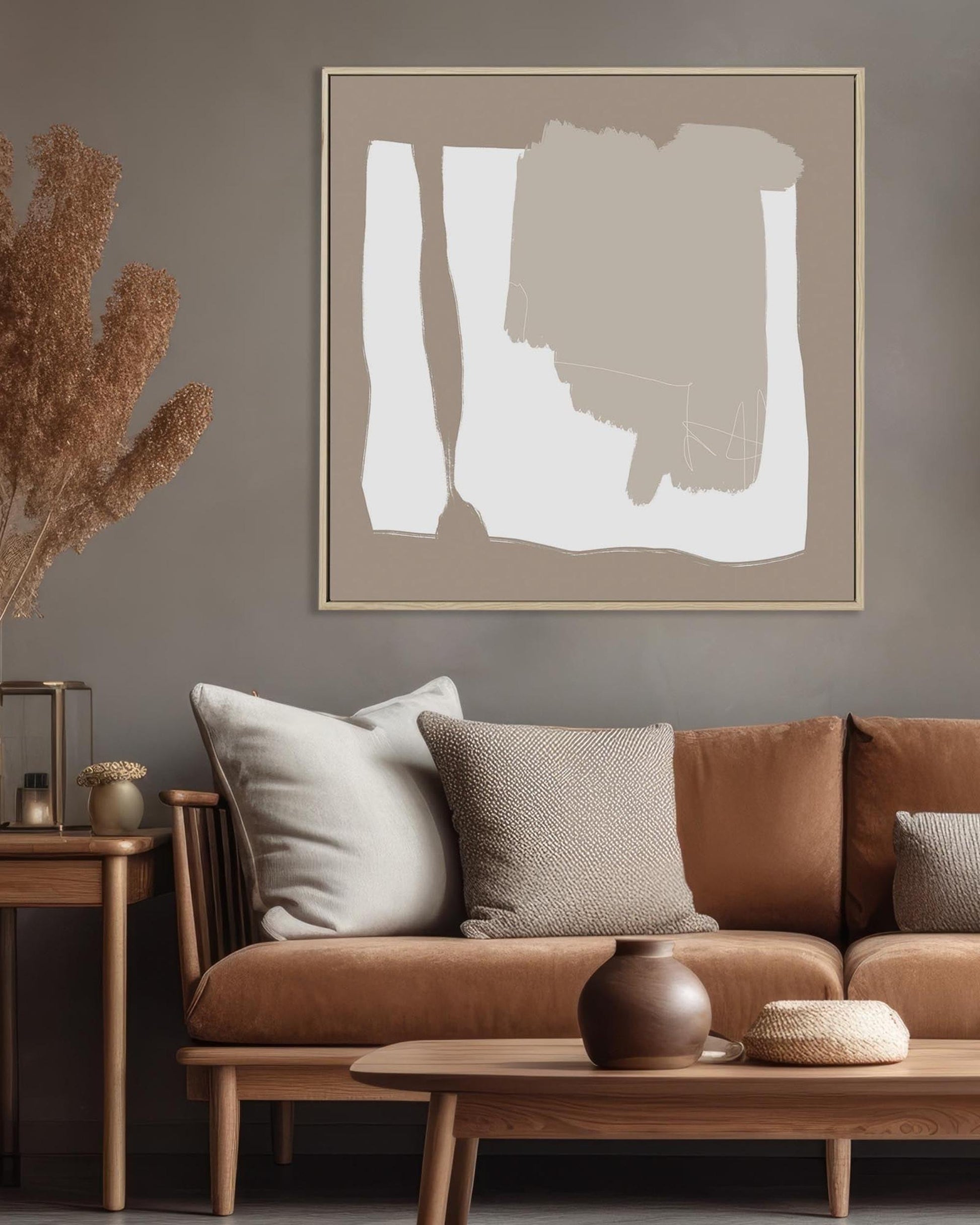 Living room with brown sofa, abstract art on wall, and wooden coffee table.