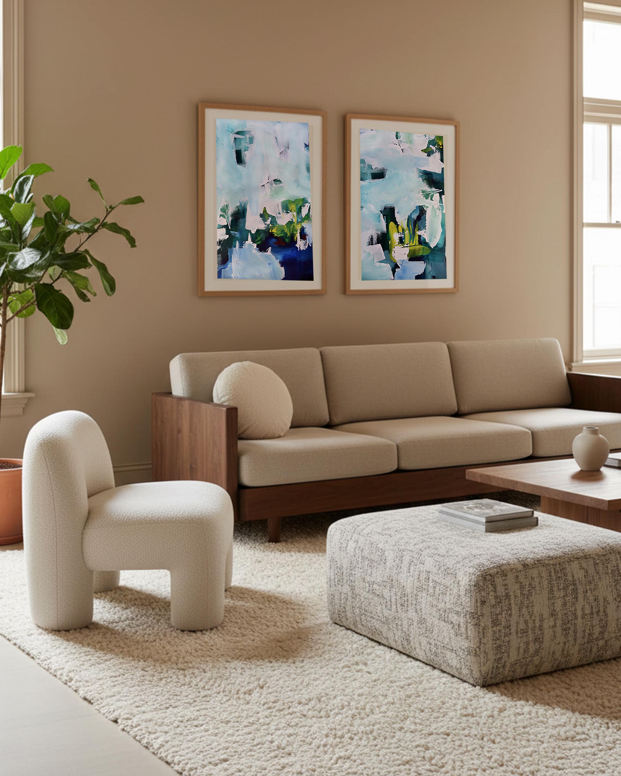 Modern living room with beige sofa, white armchair, and abstract art on the wall.