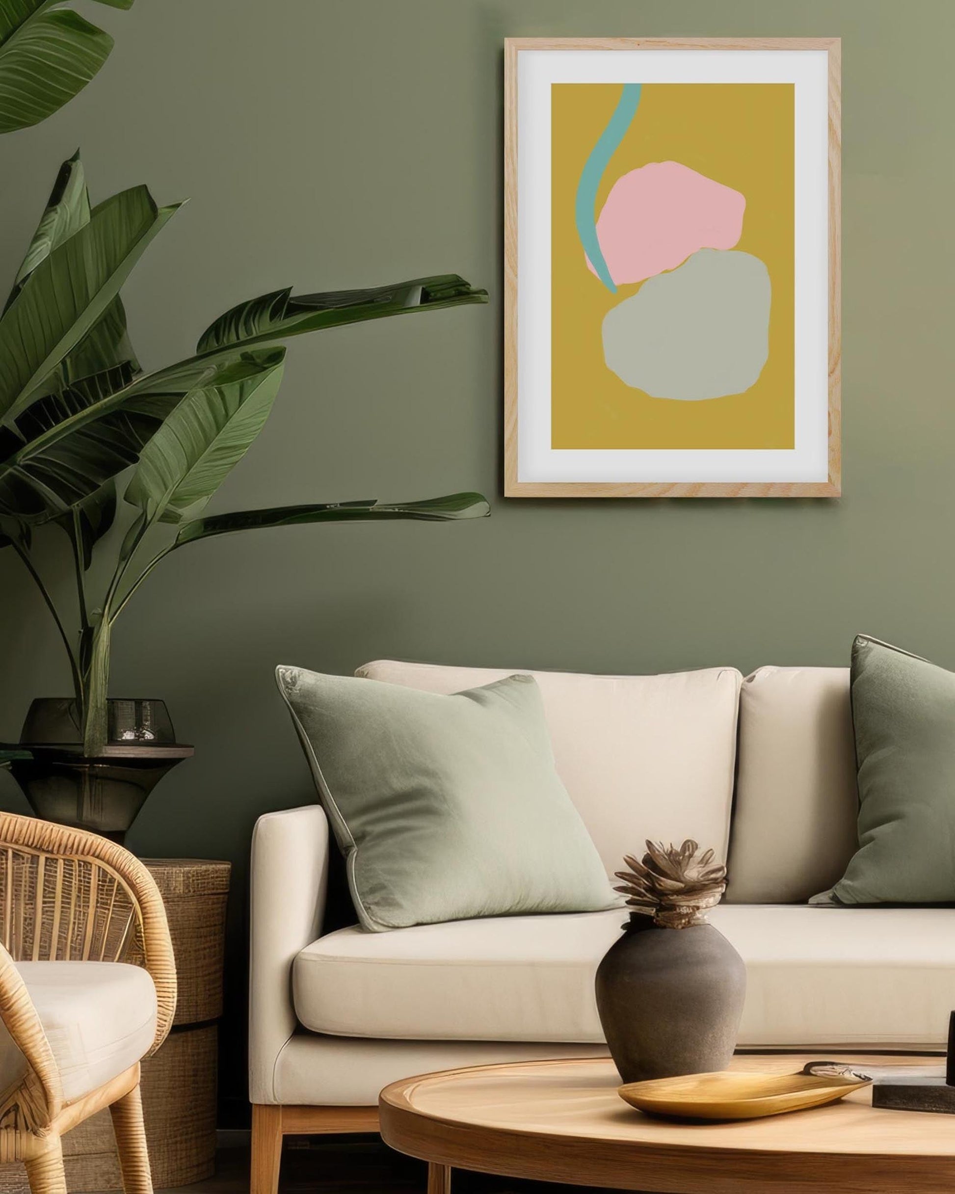 Living room with a beige sofa, abstract art on the wall, and decorative items.