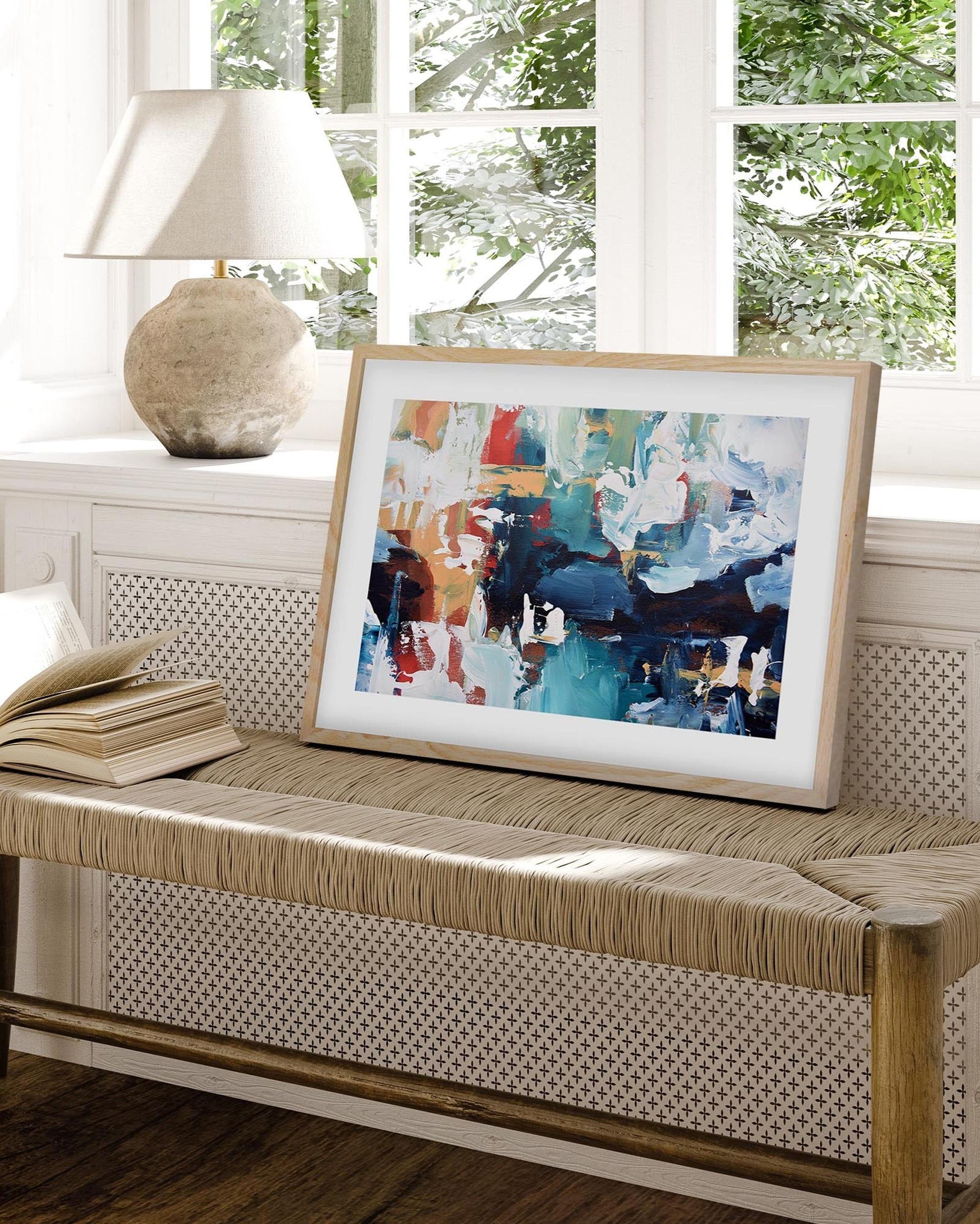 abstract picture framed in an oak frame on the side bench in a modern living room