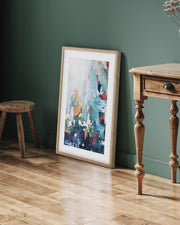 framed abstract artwork on a green wall