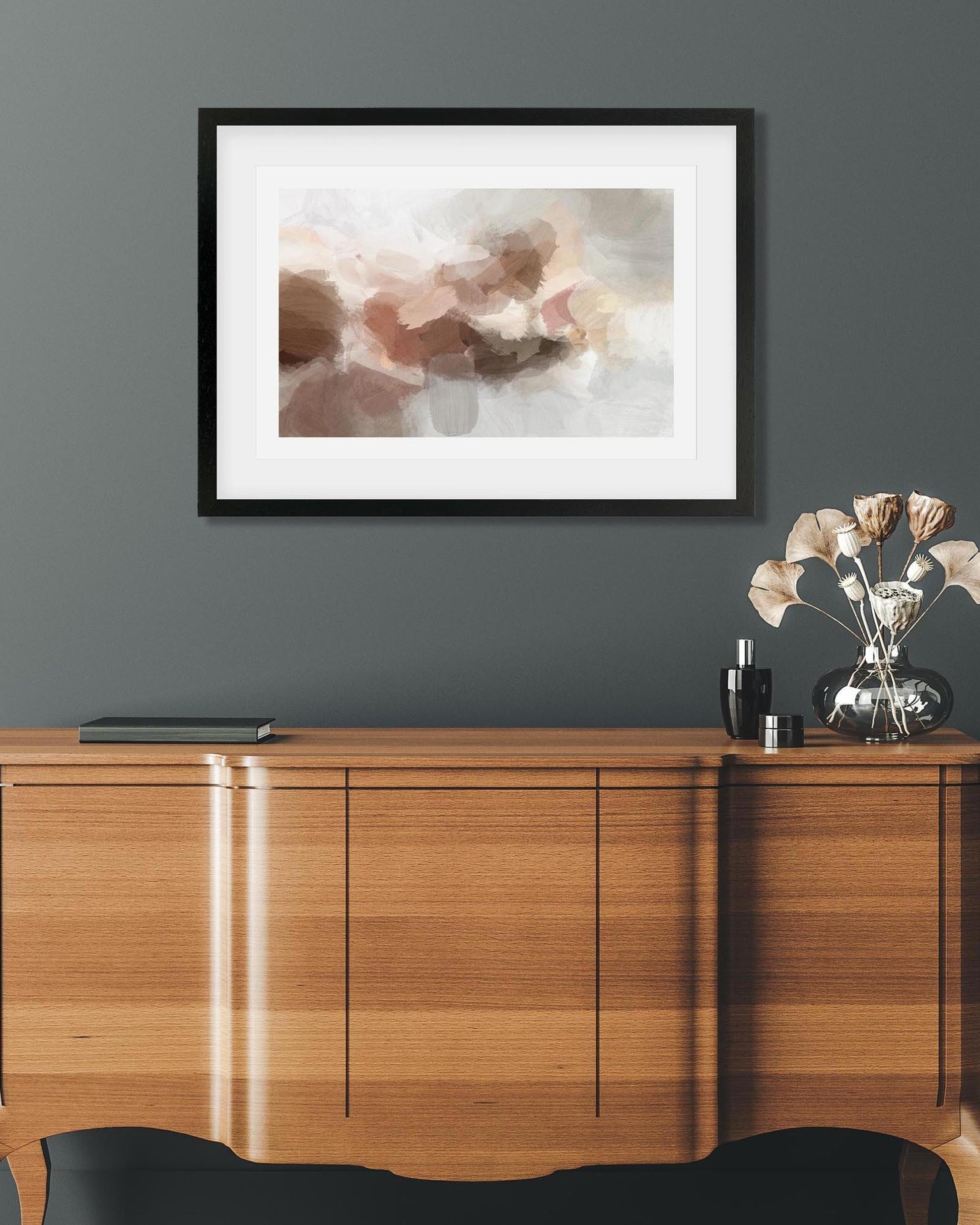 Wooden sideboard with abstract art on the wall