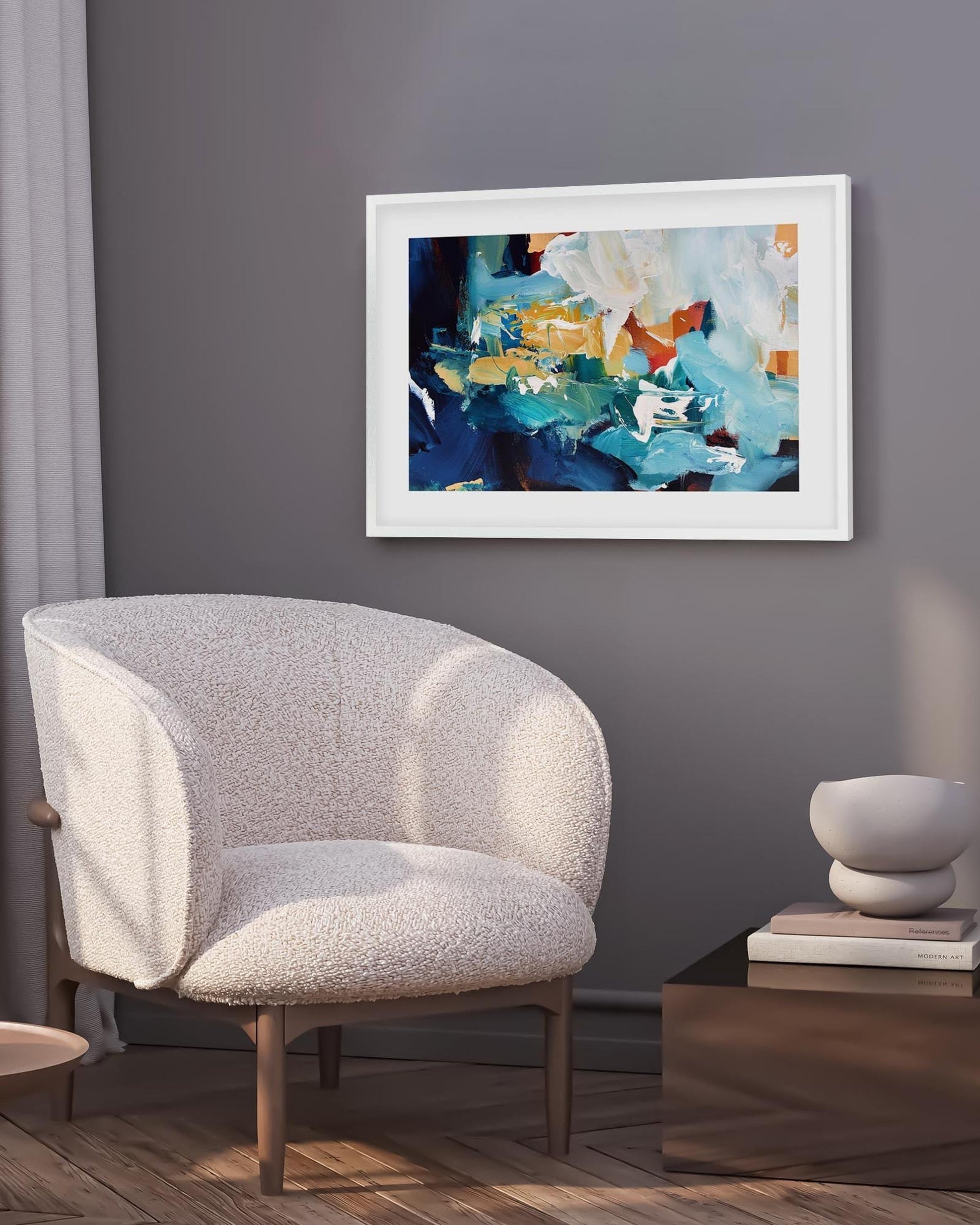 Gray armchair in a room with a abstract painting on the wall.