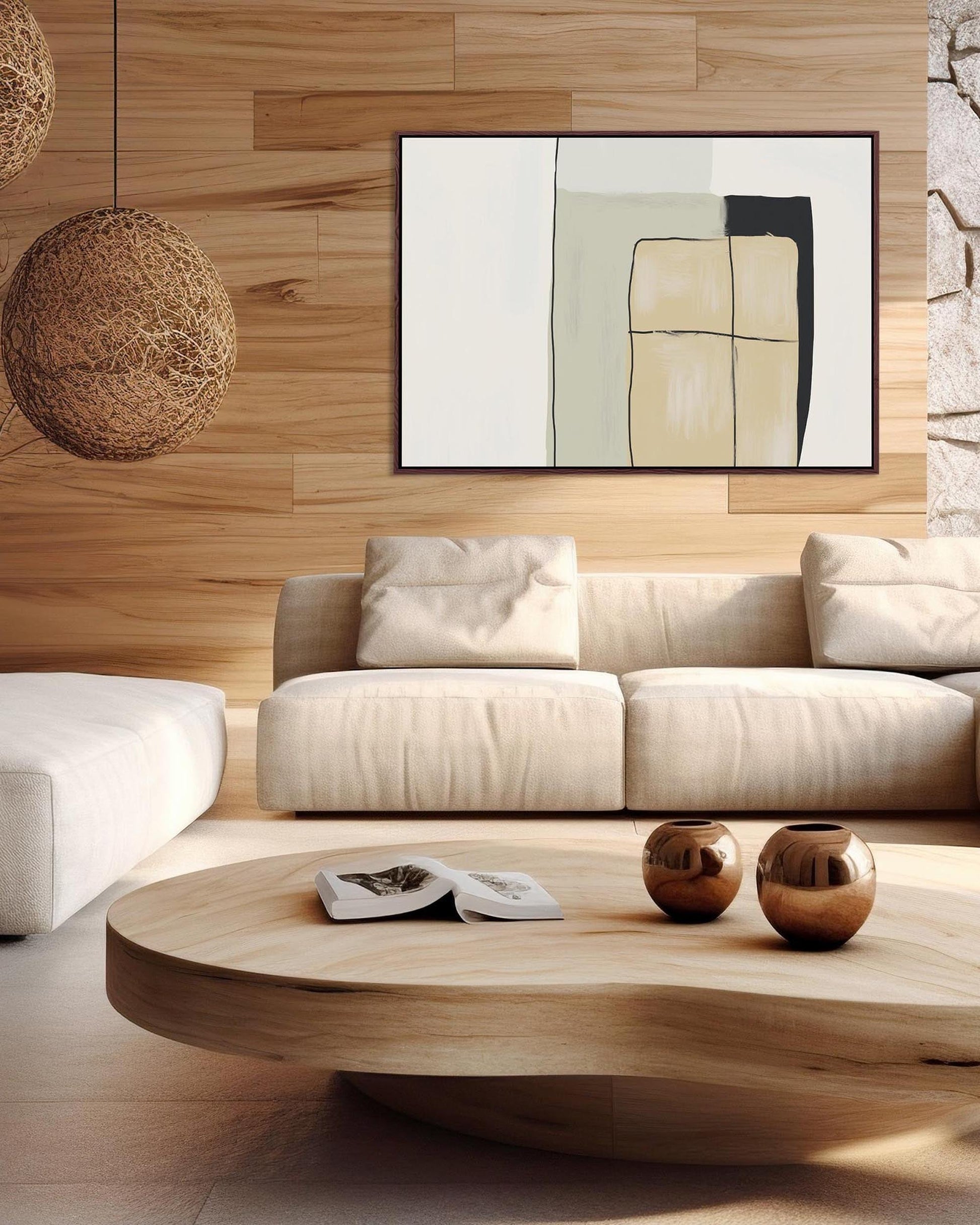 Modern living room with a beige sofa, wooden coffee table, and abstract art on the wall.