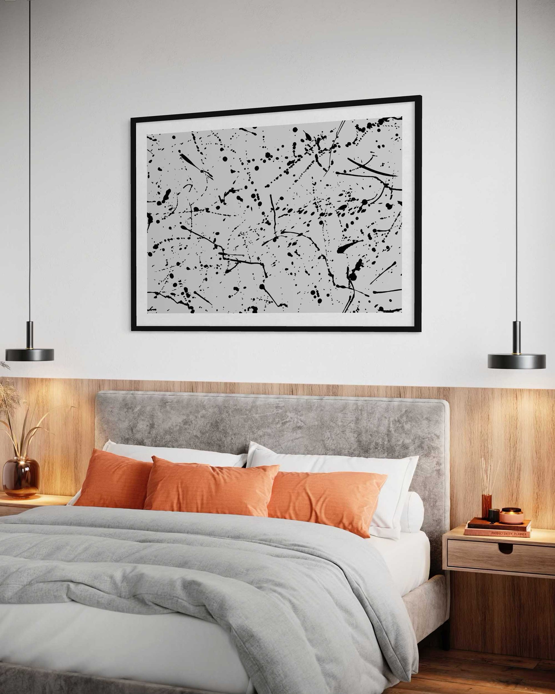 Modern bedroom with a bed, orange pillows, and abstract art on the wall.