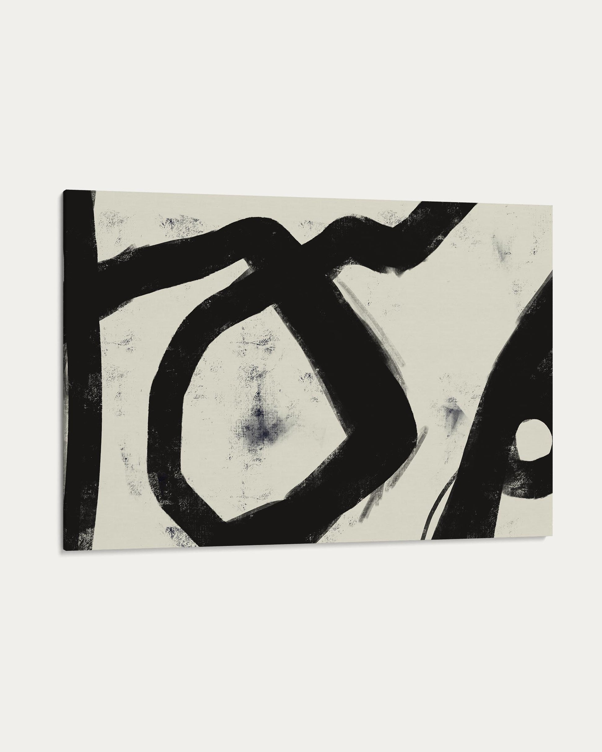 Abstract black and white artwork on a textured surface