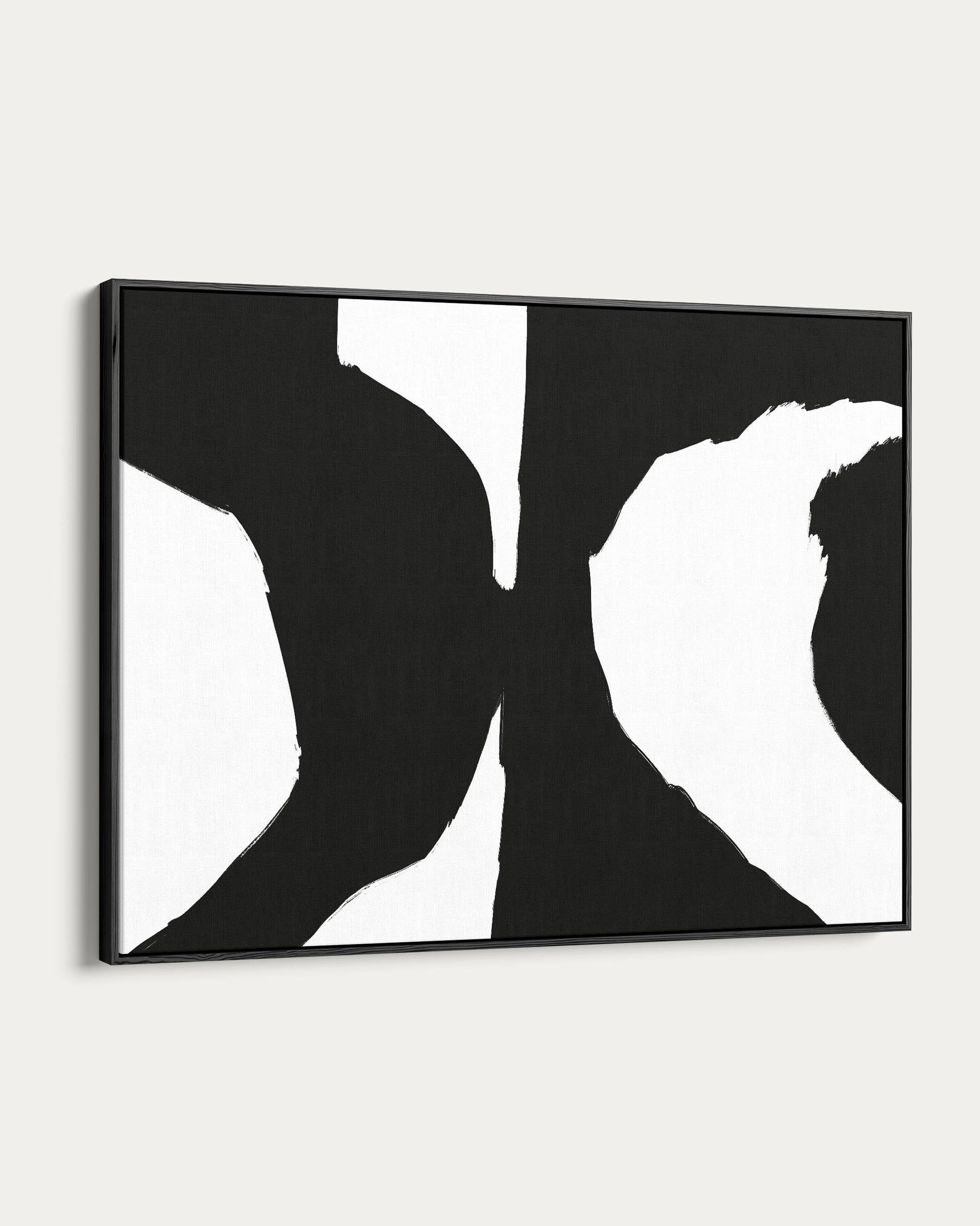 Black and white abstract art piece in a frame on a white wall