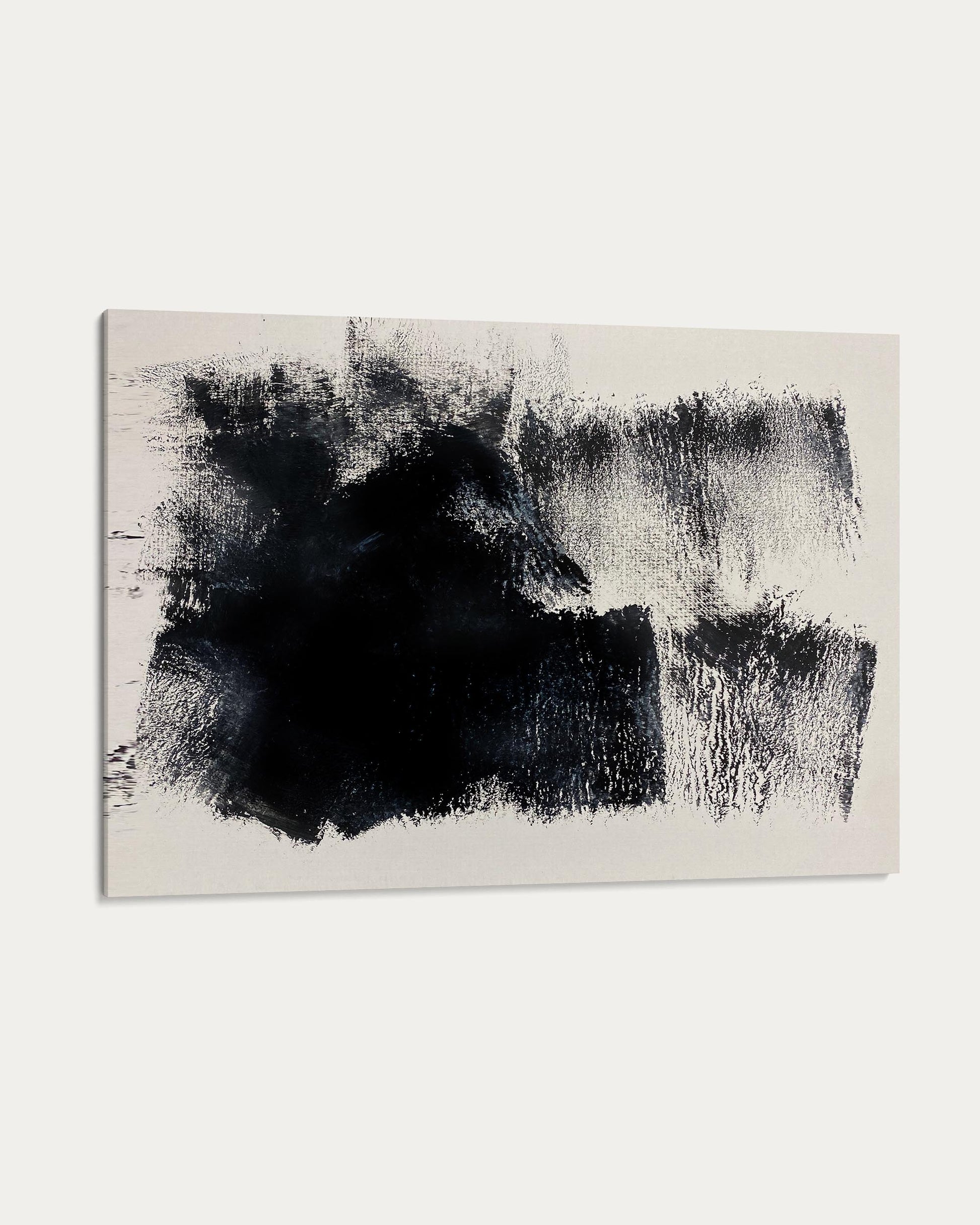 Abstract art piece with black and white brush strokes on a beige background