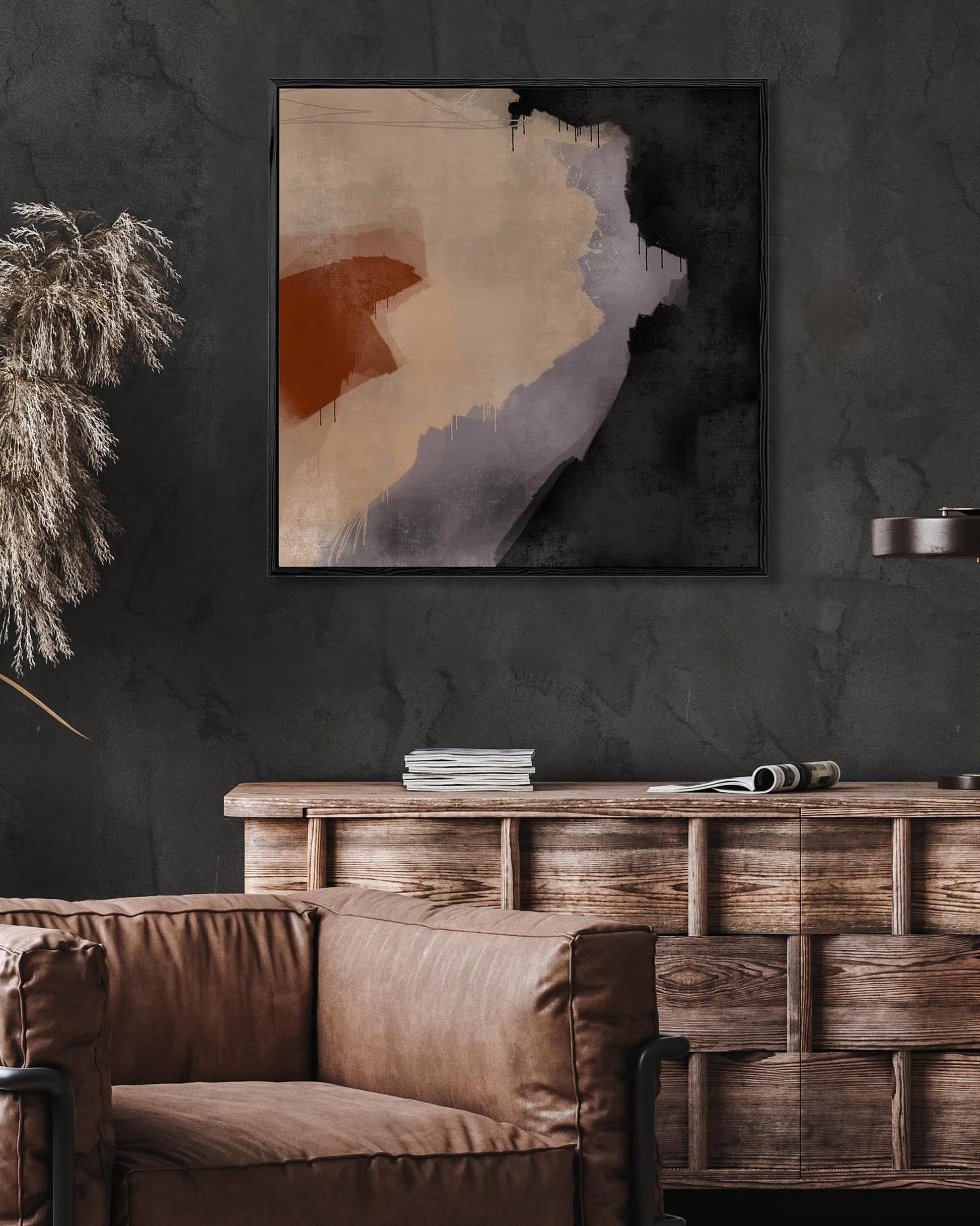 Modern living room with brown leather sofa, wooden cabinet, and abstract art on a dark wall.