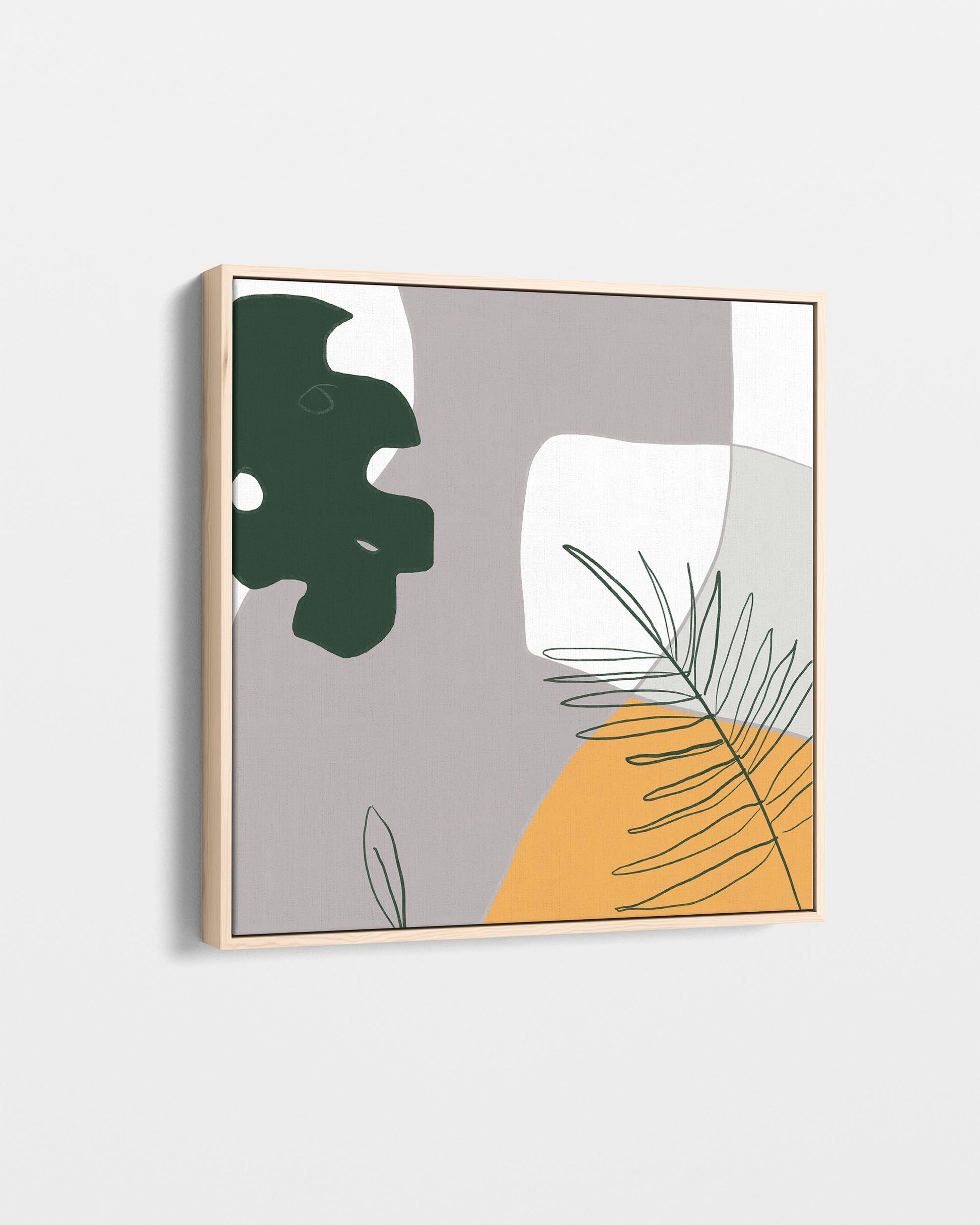 Framed artwork with abstract design featuring green and yellow elements on a light gray background