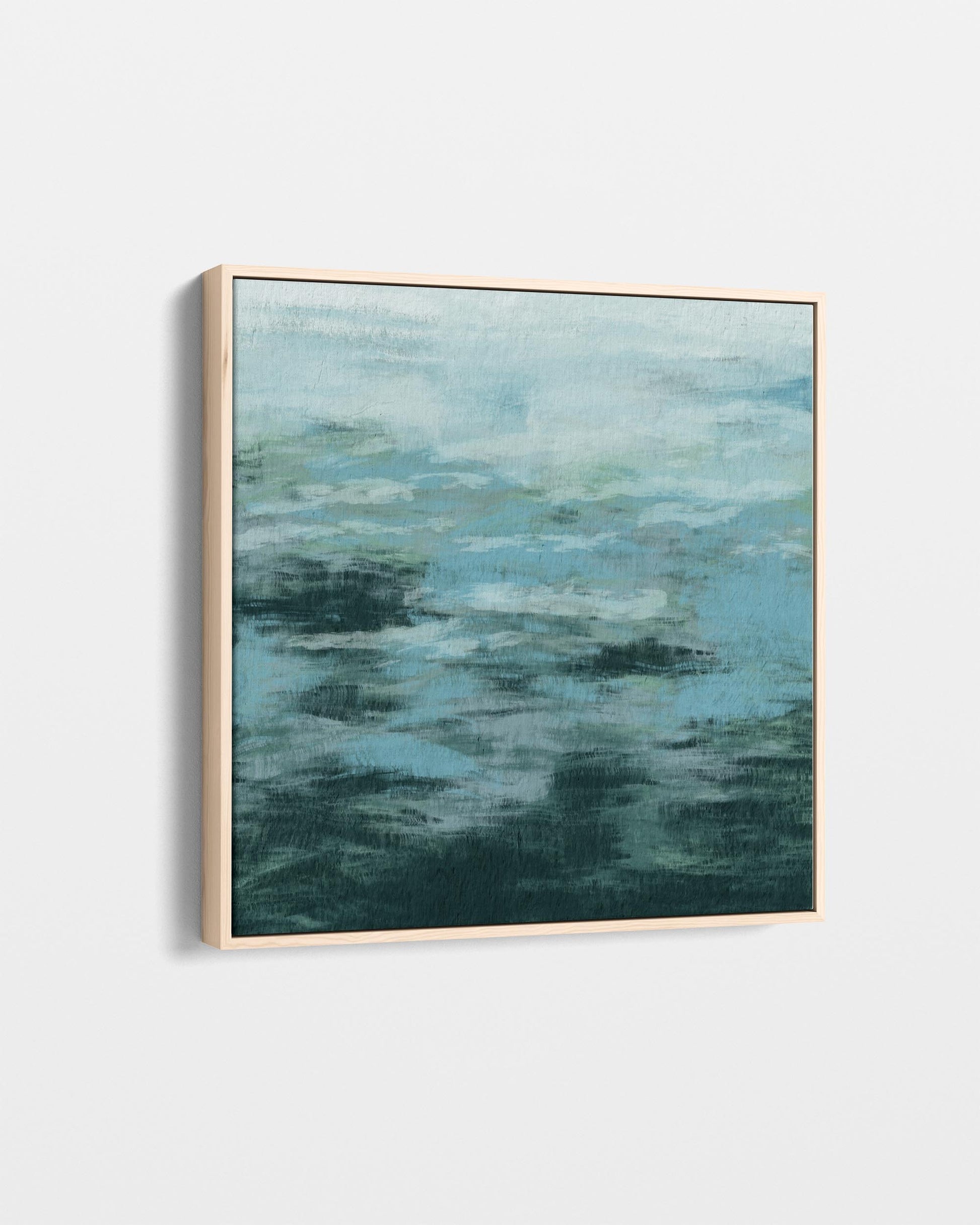Framed abstract artwork with blue and green hues on a white background