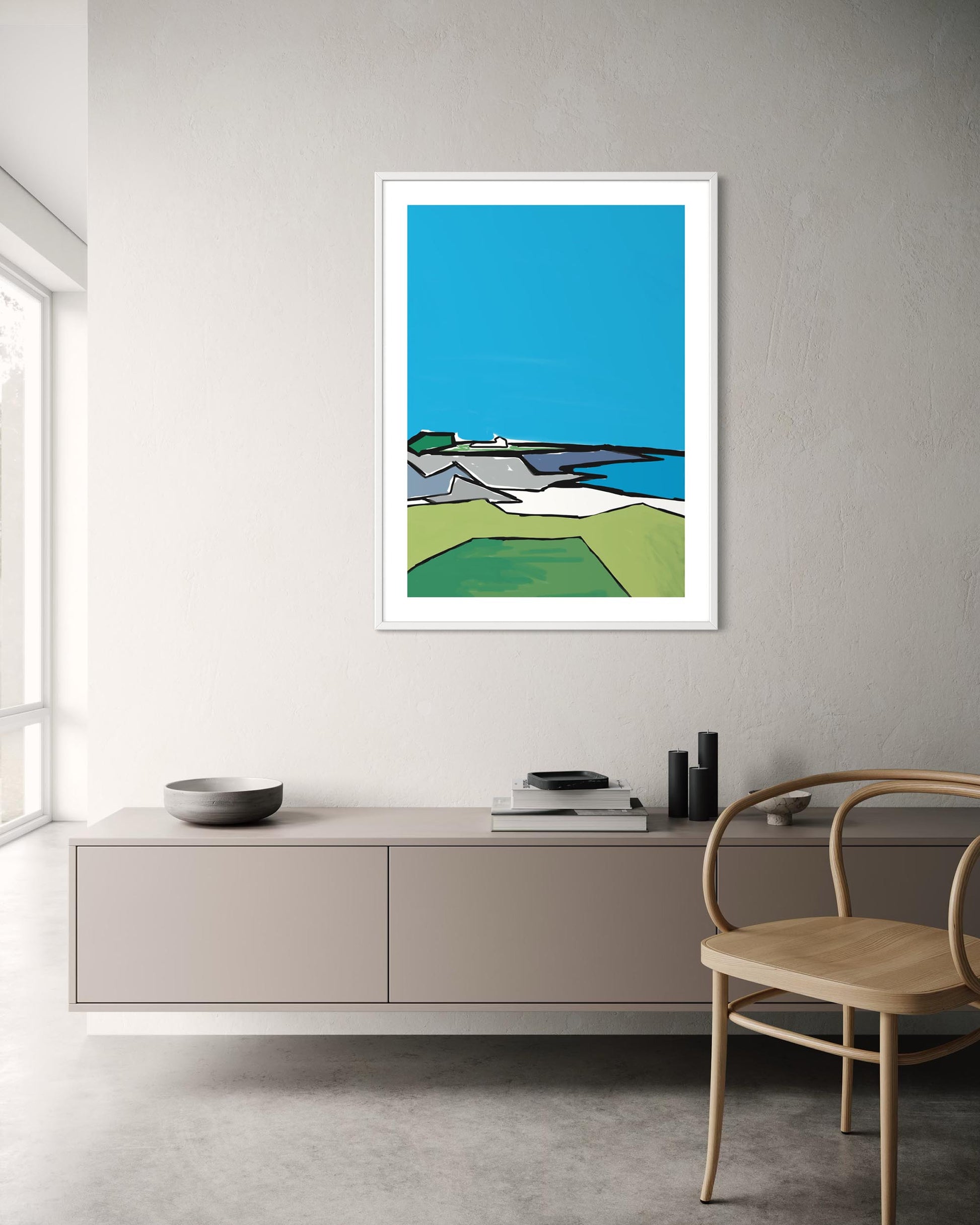 Framed abstract artwork on a wall in a modern room with furniture.