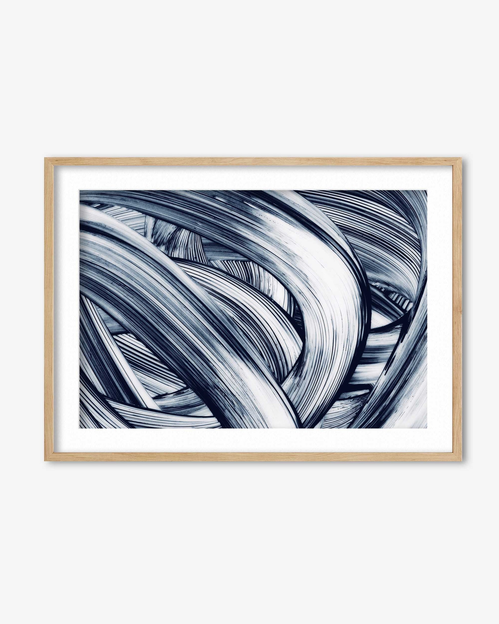 Framed abstract art print with wavy lines in black and white on a white background