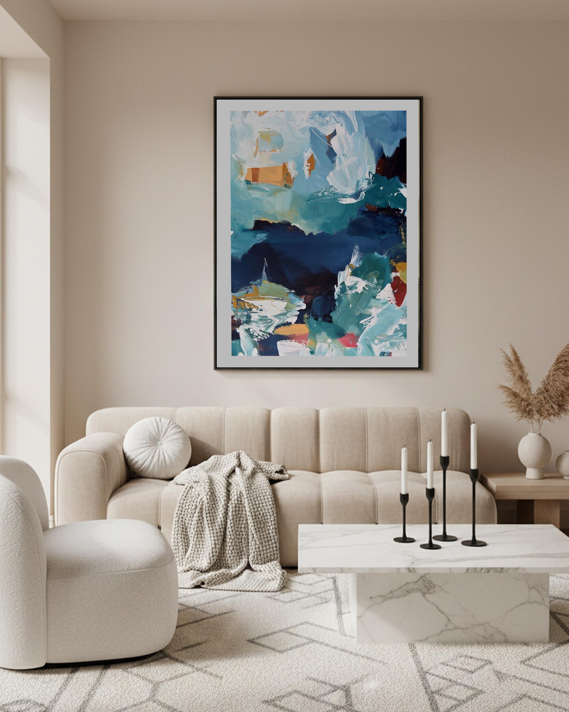 Modern living room with a beige sofa, abstract art, and decorative elements.