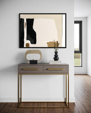 Modern console table with abstract art and decor in a stylish room.