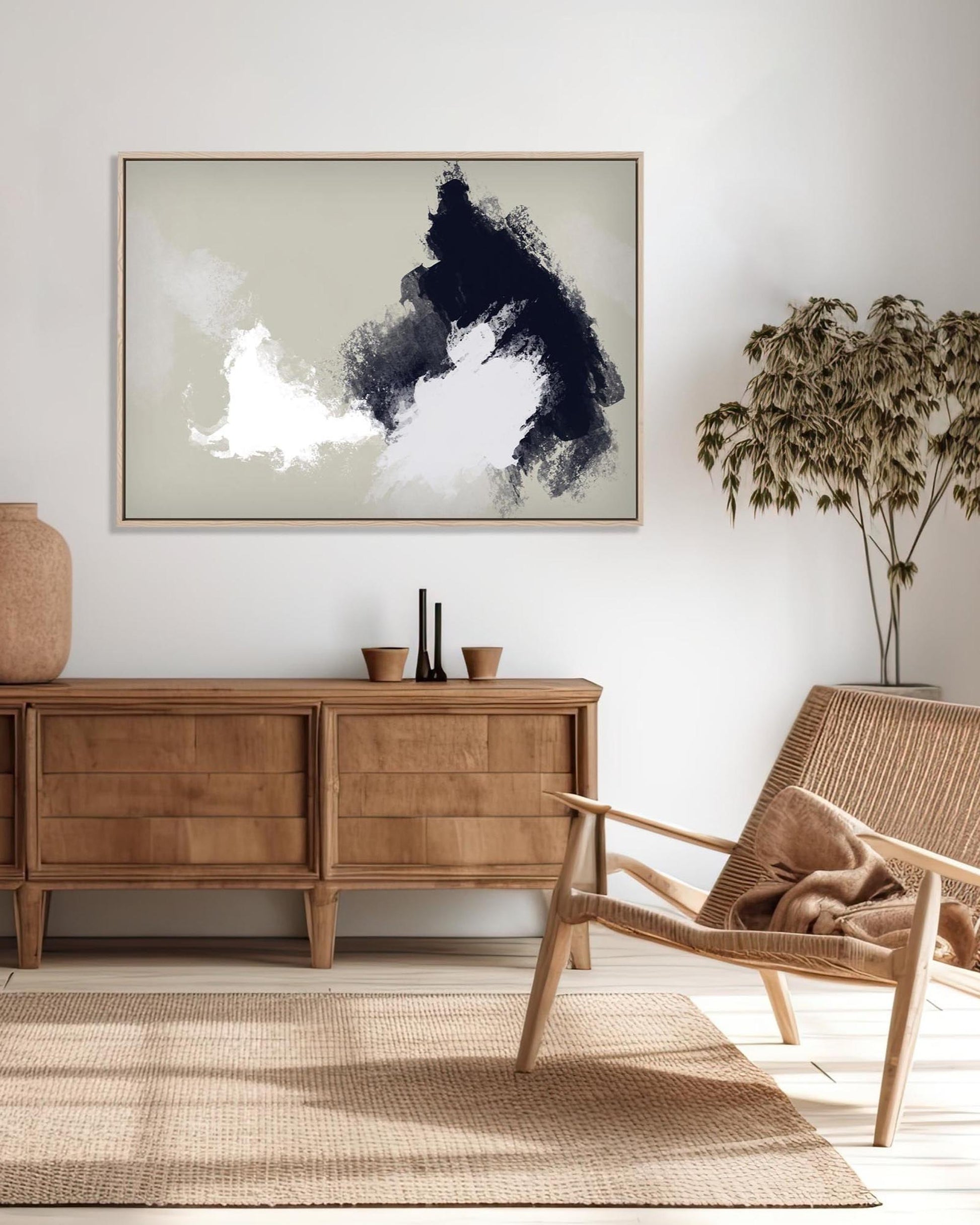 Living room with wooden sideboard, wicker chair, and abstract art on the wall.