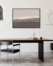 Dining room with a wooden table, black chairs, and abstract art on the wall.