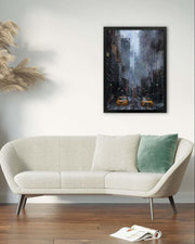 Beige sofa with a green pillow in a room with a painting of a city street scene on the wall.
