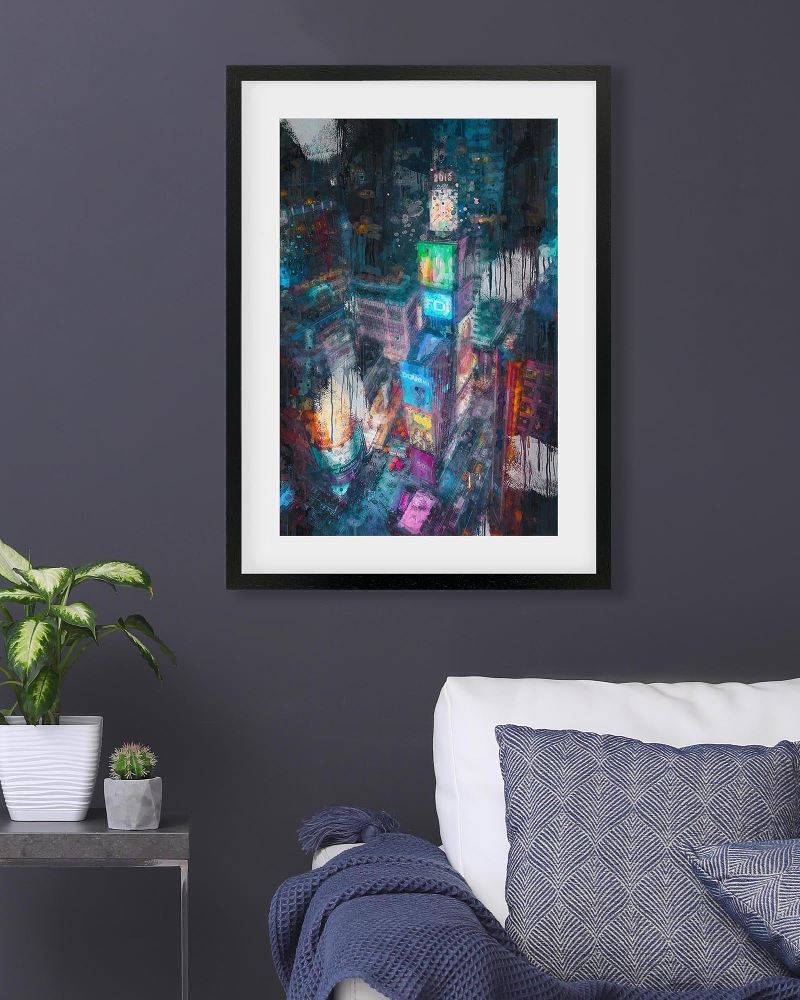 Framed abstract painting on a dark wall above a sofa with decorative pillows.