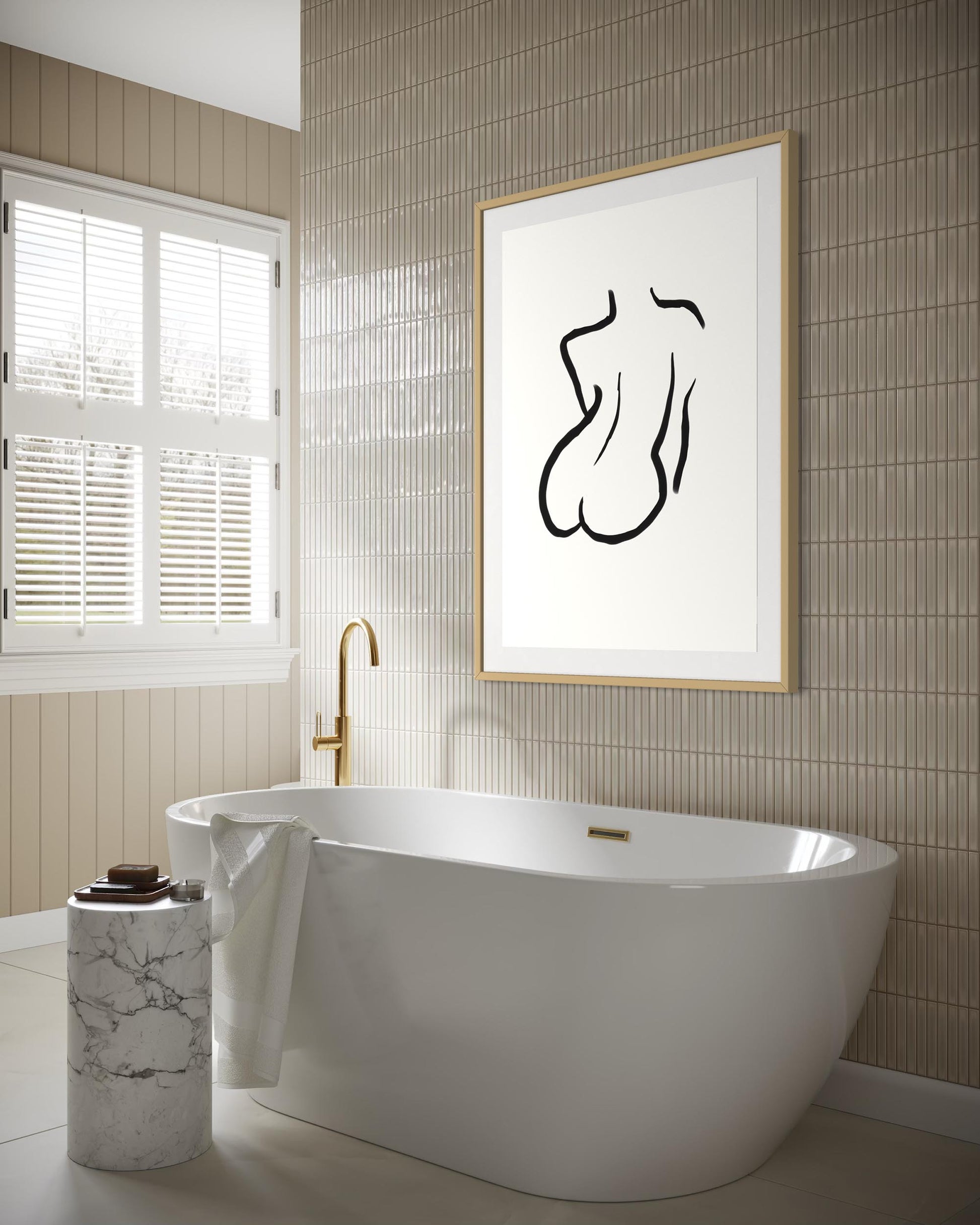Modern bathroom with a freestanding bathtub, marble candle holder, and abstract art on the wall.