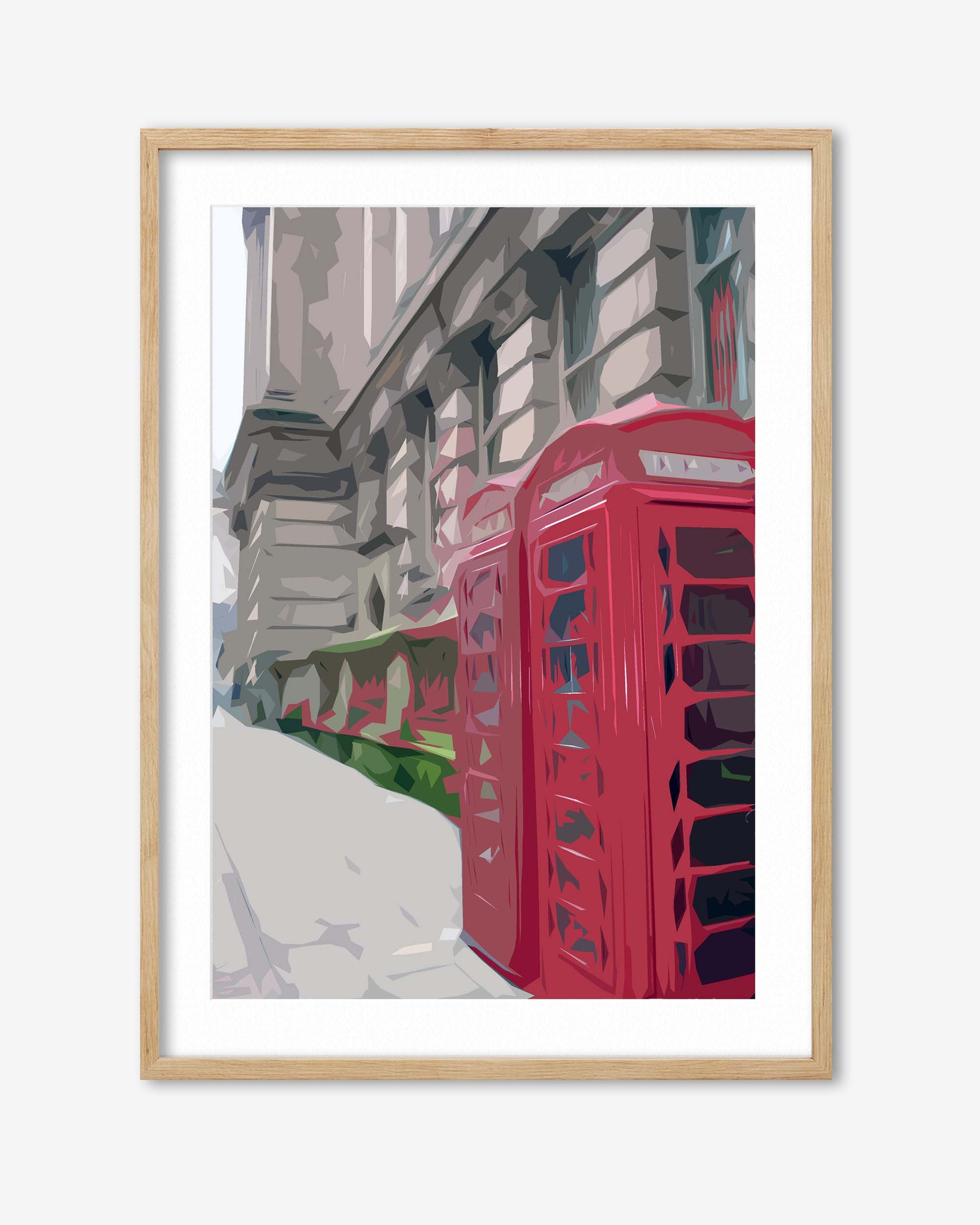Framed artwork of a red telephone box on a city street with a light wooden frame.