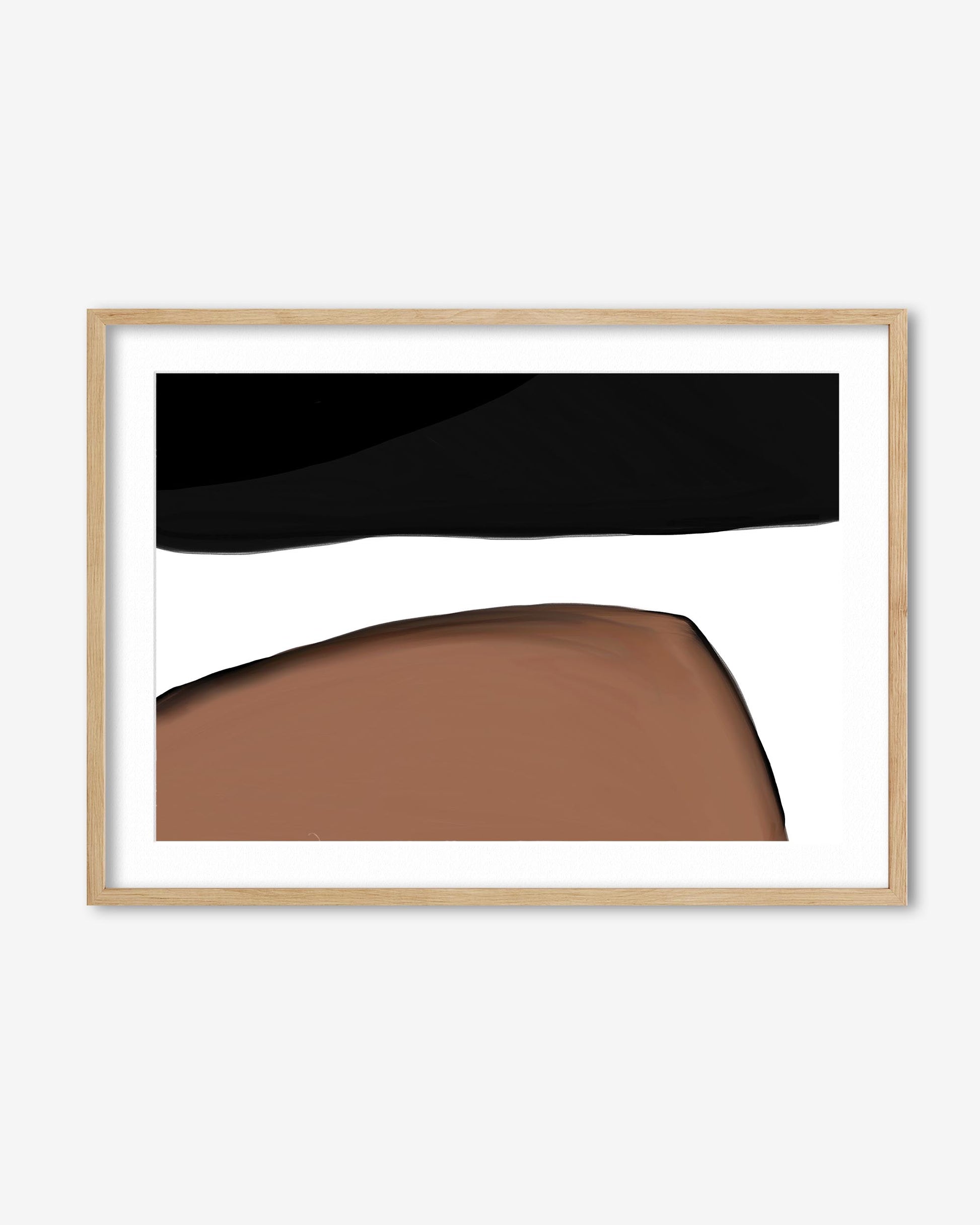Framed abstract art with black and brown shapes on a white background