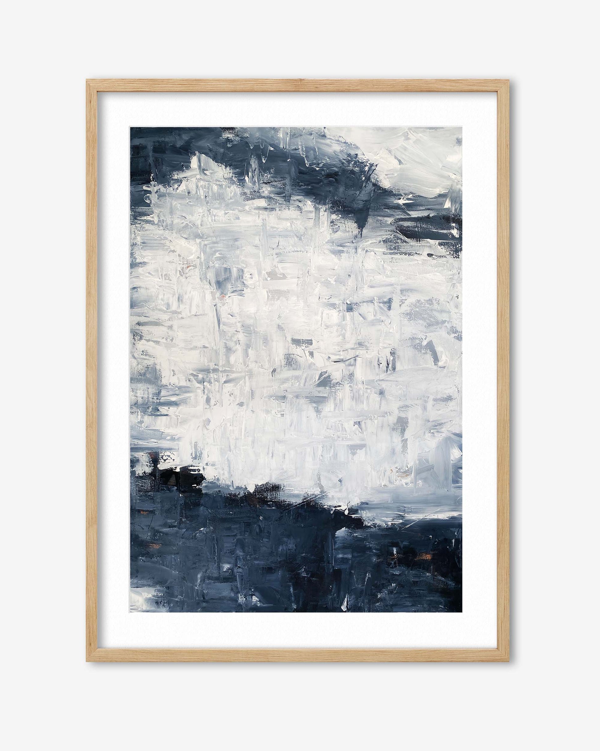 Abstract art print in a wooden frame on a white background