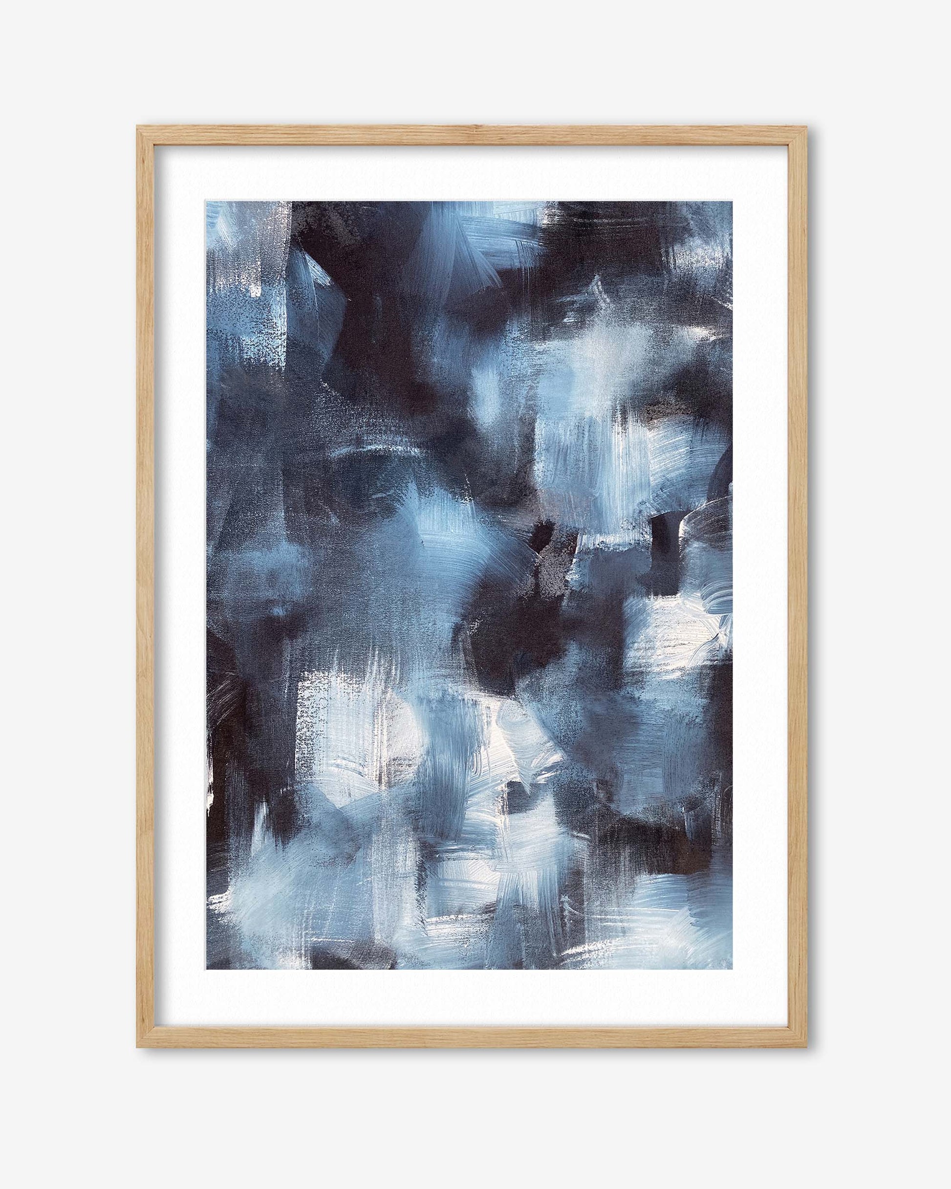 Abstract art print in a wooden frame on a white background