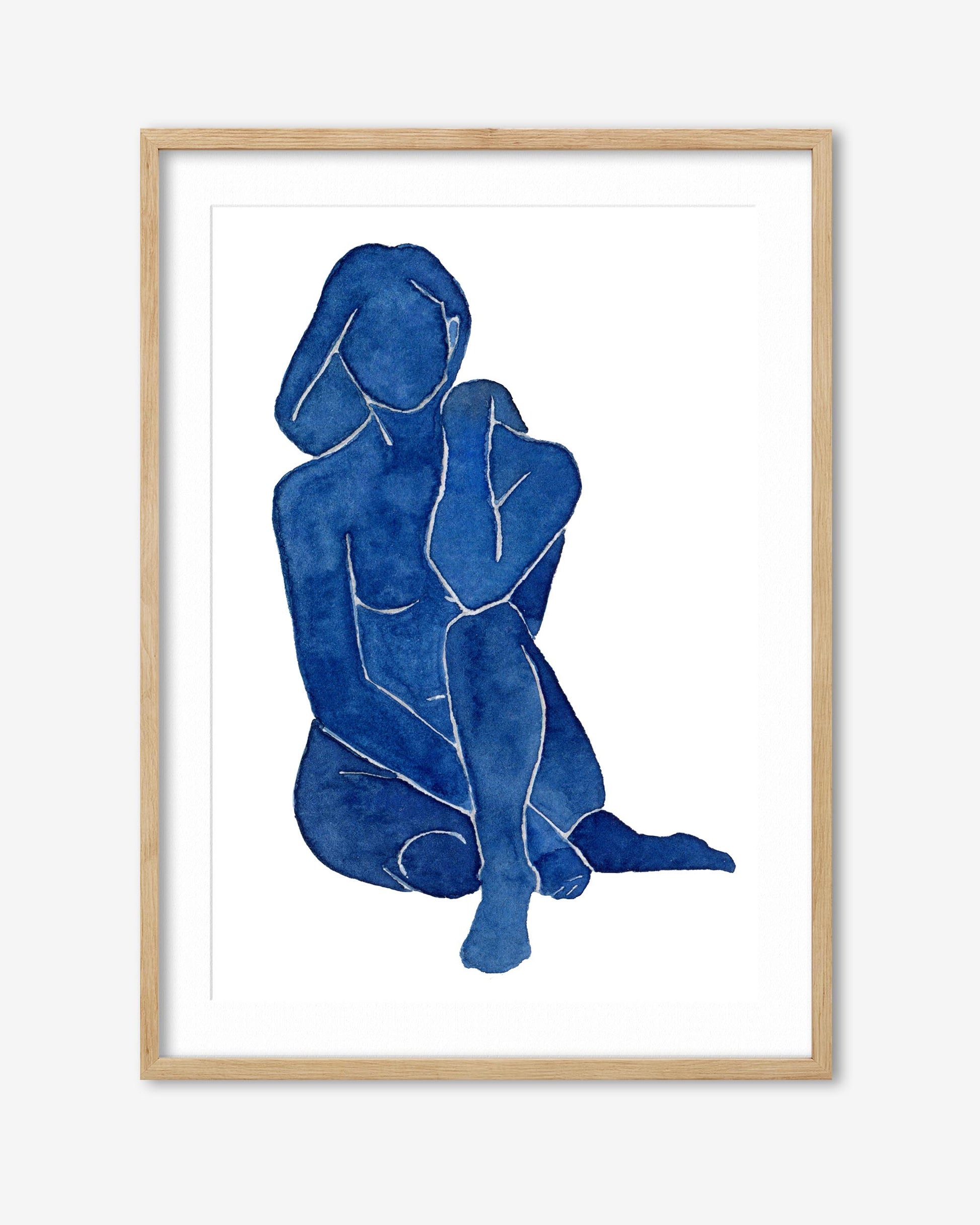 Framed artwork of two abstract blue figures on a white background