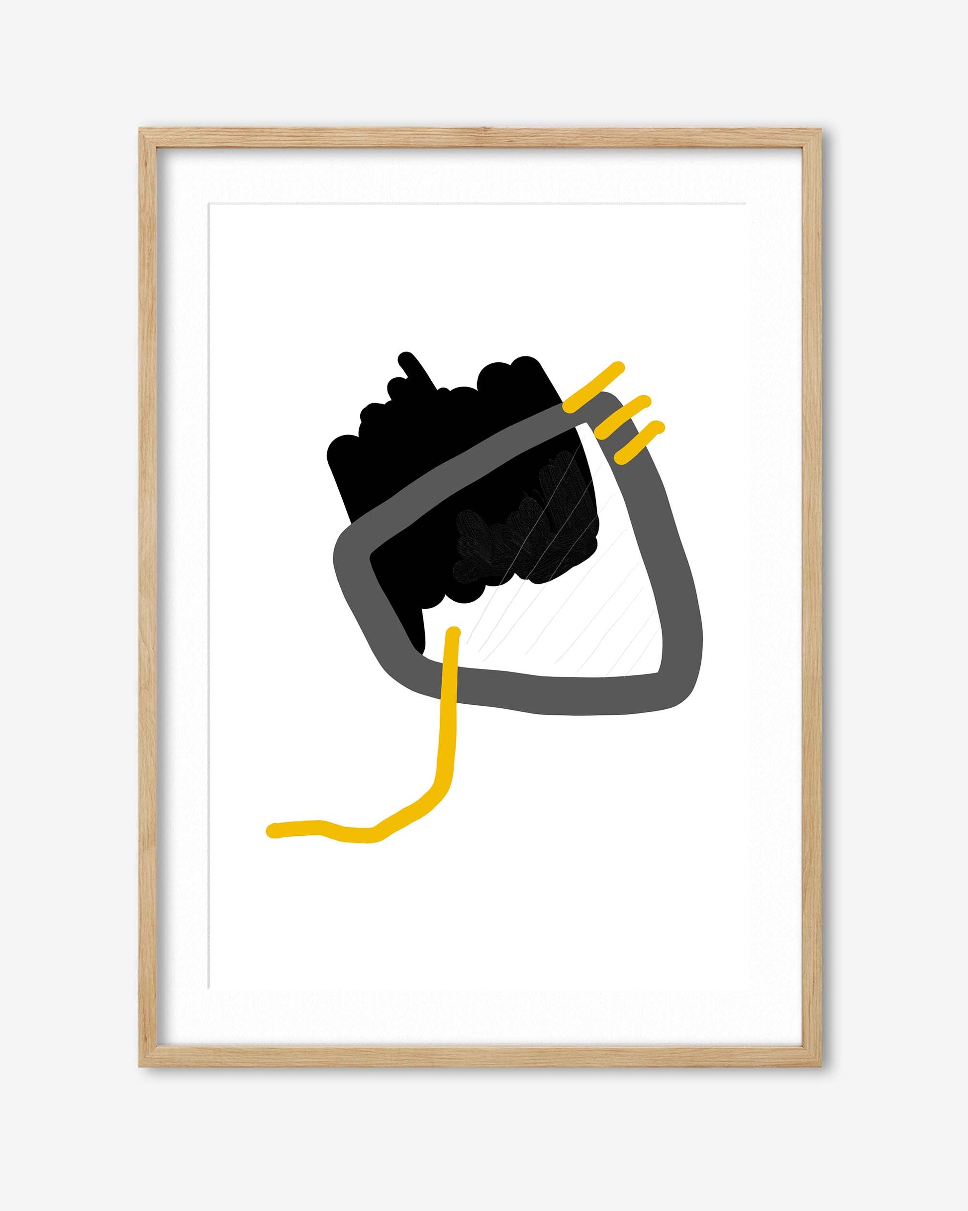 Framed artwork of a black glove holding a yellow tool on a white background